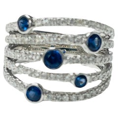 Anello cocktail con zaffiro blu e diamante in oro bianco 18 carati