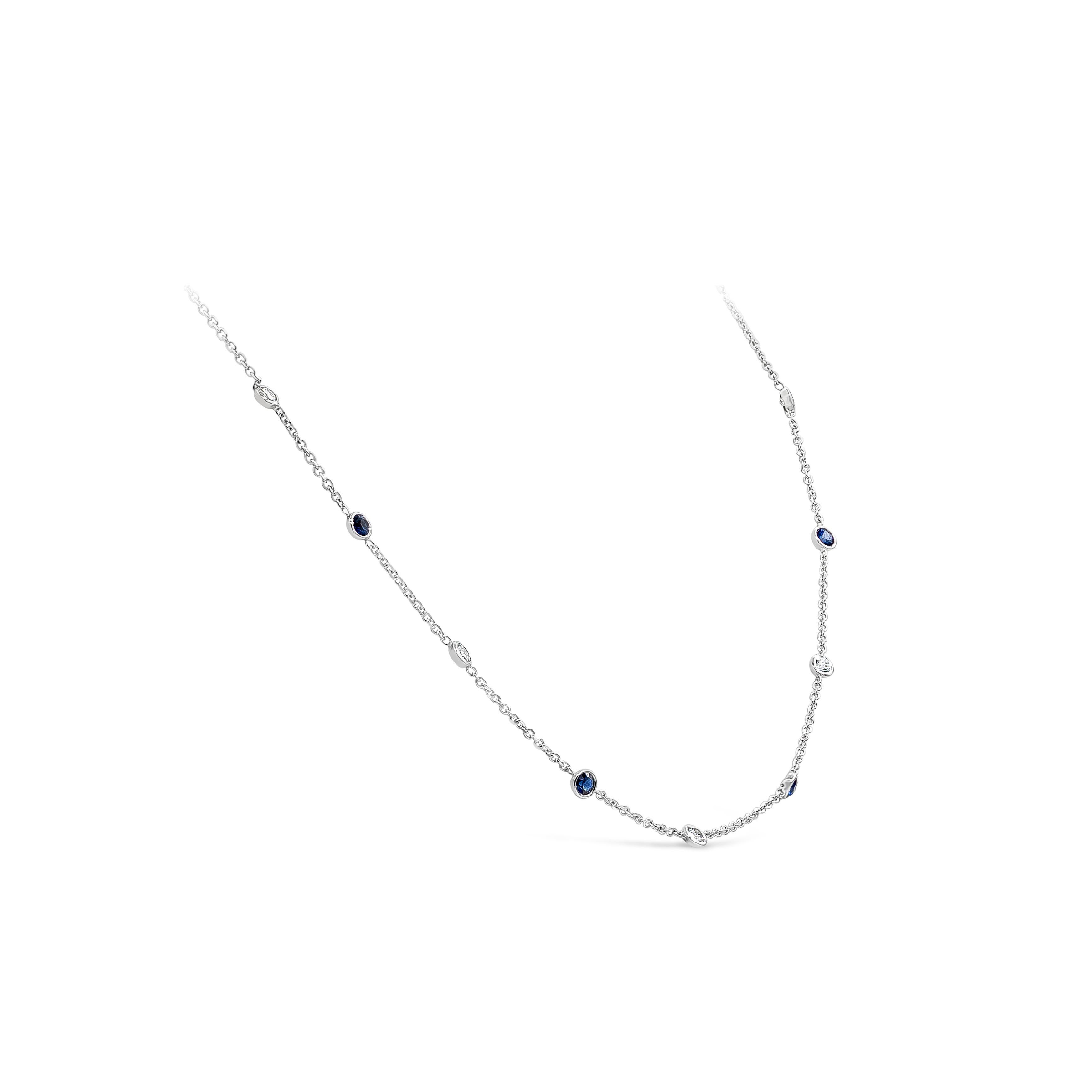A classic and stylish diamonds by the yard necklace showcasing round blue sapphires alternating with round brilliant diamonds, spaced evenly in an 14k white gold bezel and chain. Sapphires weigh 0.55 carats total; diamonds weigh 0.28 carats