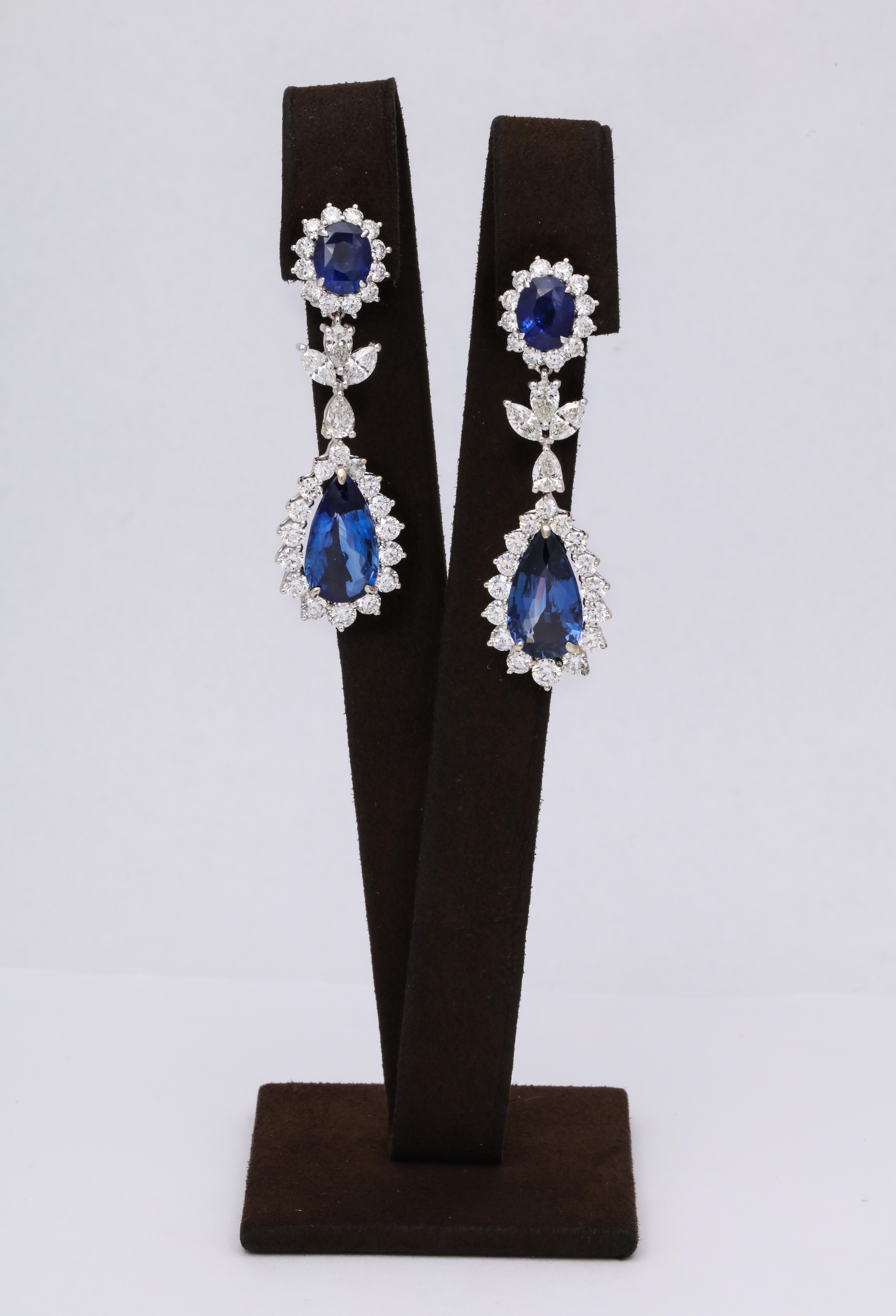 
Blue Sapphire Drop Earrings 

21.40 carats of vibrant Ceylon Blue Sapphires surrounded by 7.27 carats of white pear, marquise and round brilliant cut diamonds. 

The pear shape drops weigh 15.03 carats and are GRS certified.

The earrings measure