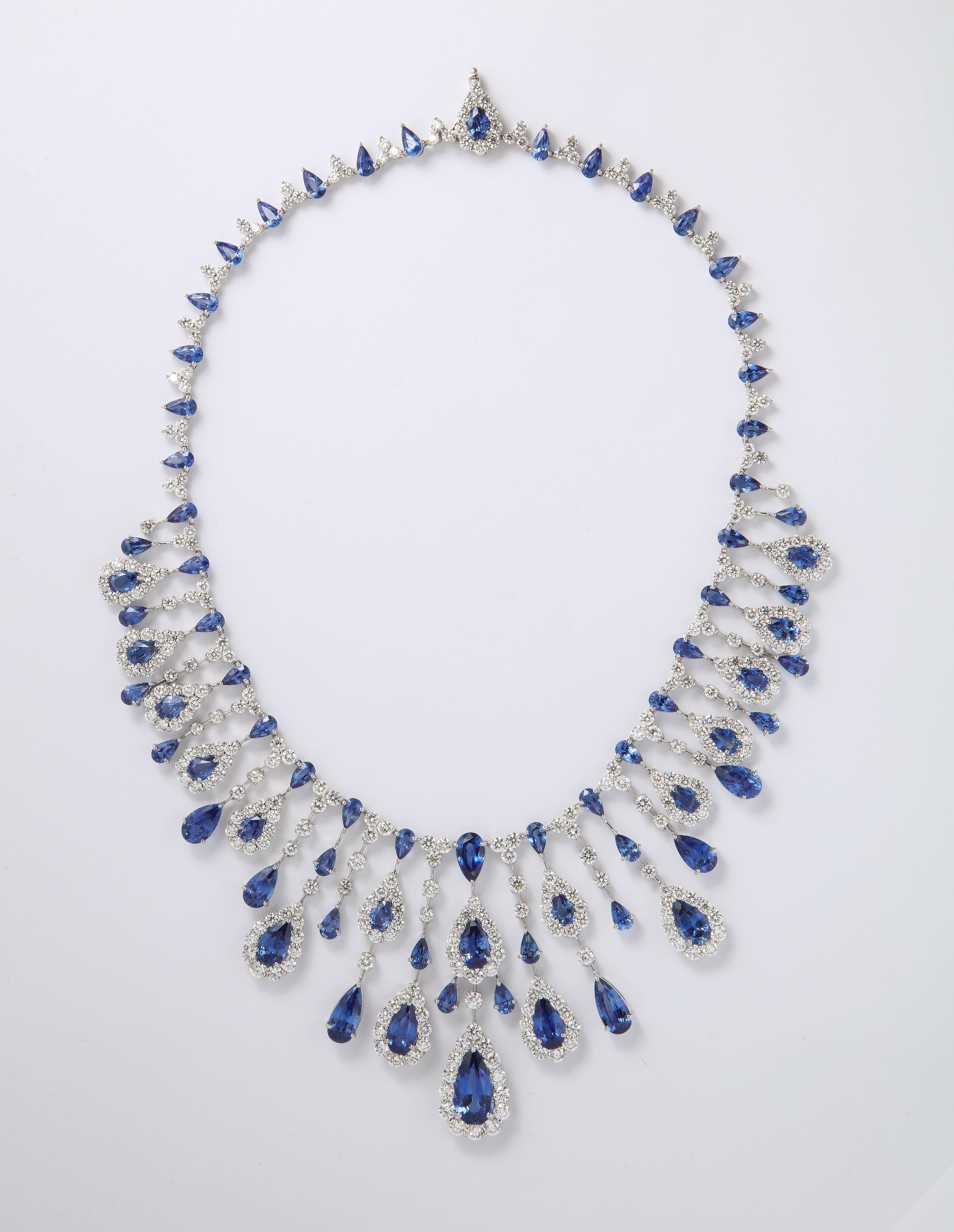 
A GRAND piece. 

77.40 carats of fine Ceylon Blue Sapphires
36.01 carats of white round brilliant cut diamonds. 

18k white gold 

2.5 inch long center drop, 16.5 inch length that can be adjusted. 