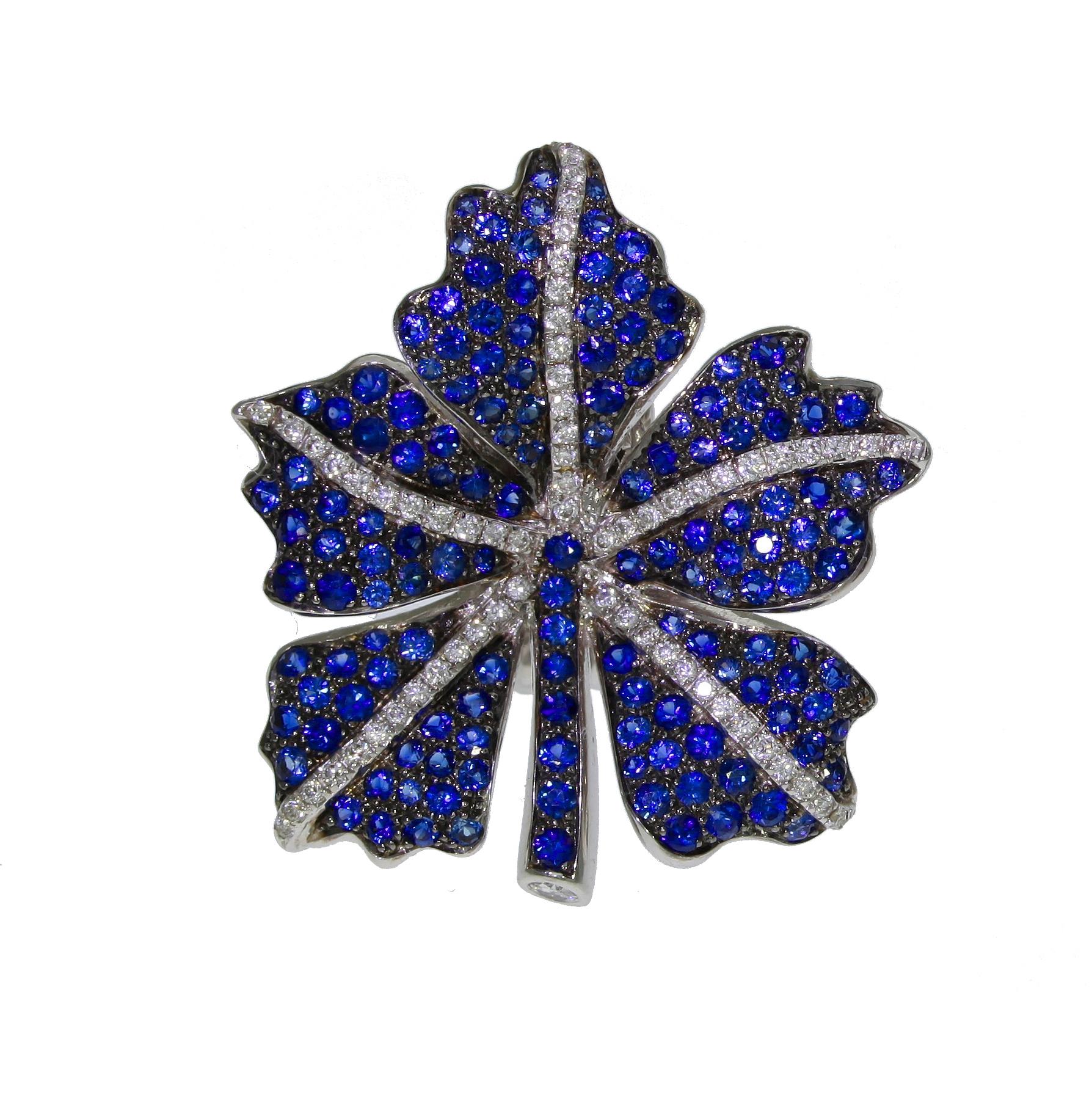 Enchanting and playful clip-on earrings by Chatila with a leaf shaped design. Made from 18-karat white gold and inlaid with blue sapphires and white diamonds. Perfect for those who like statement jewelry.

Details:

- 130 Diamonds with a total