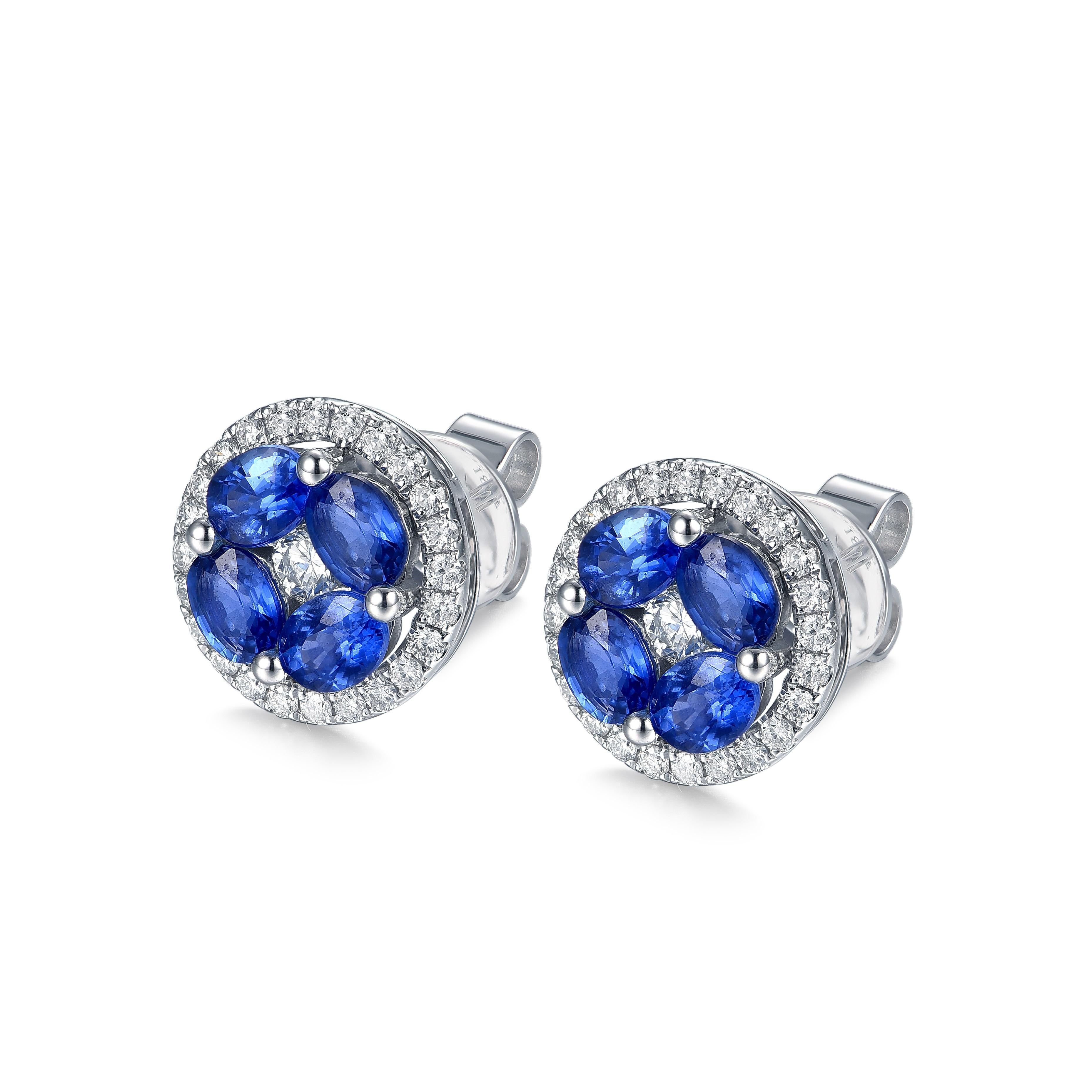 Each earring has 4 beautiful blue 4x3mm oval sapphires surrounded by a halo of .26cts diamonds set in 18k white gold.  They are a great everyday earring. They sit flat on the ear making them comfortable to wear while doing everyday activities.  