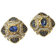 Blue Sapphire and Diamond Earrings Set in 18 Karat Yellow Gold with Oval Centers