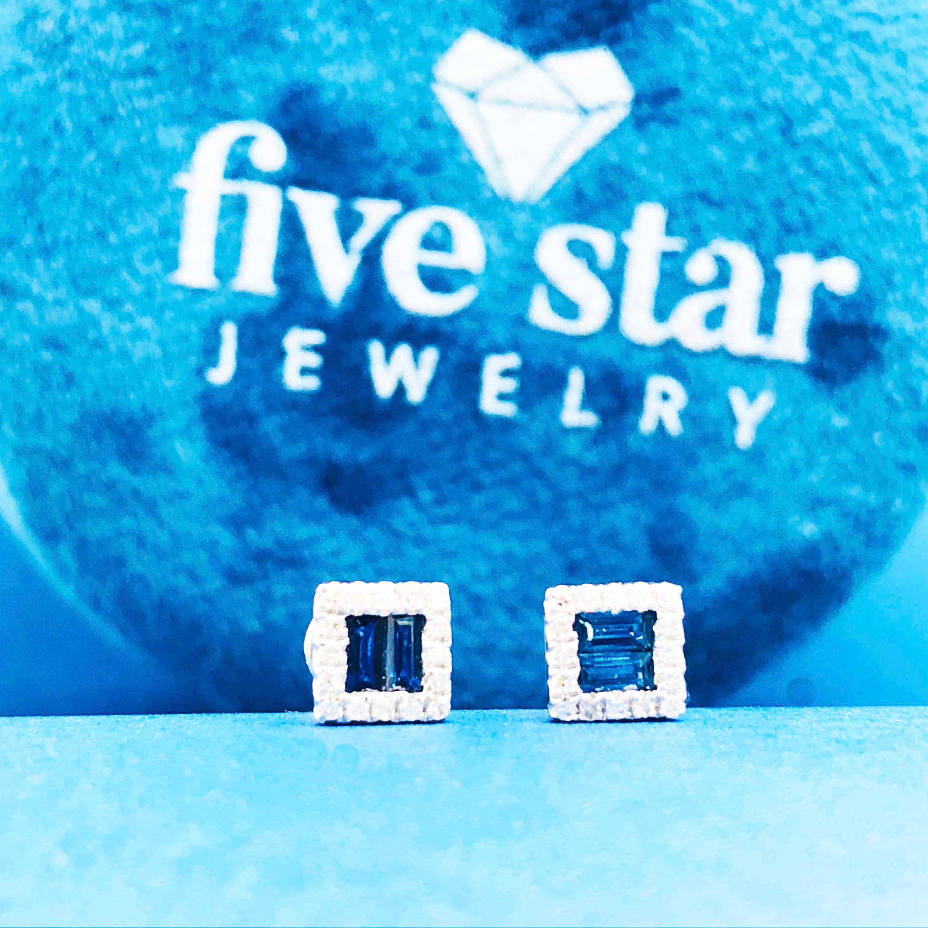 Gorgeous blue sapphire earrings with a diamond frame! These trendy earring studs are stunning. With two genuine blue sapphire gemstones cut in a baguette shape to create a perfect square shape in each earring stud. Each earring stud has a bold, deep