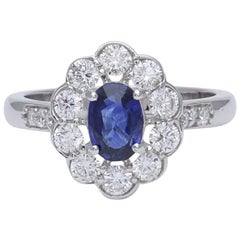 Blue Sapphire and Diamond Engagement Ring in 18 Karat White Gold