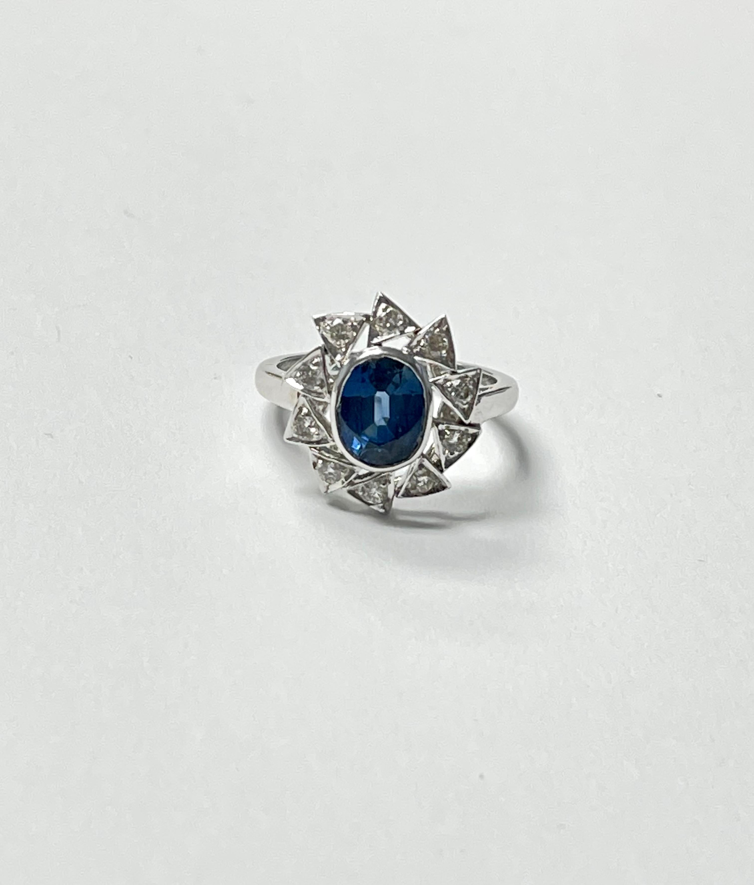 Blue sapphire and diamond engagement ring handcrafted in 18k white gold. 
The Details are as follows : 
Blue sapphire weight : 1.10 Carat 
Diamond weight : 0.60 carat ( GH color and VS clarity ) 
Metal : 18k white gold 

