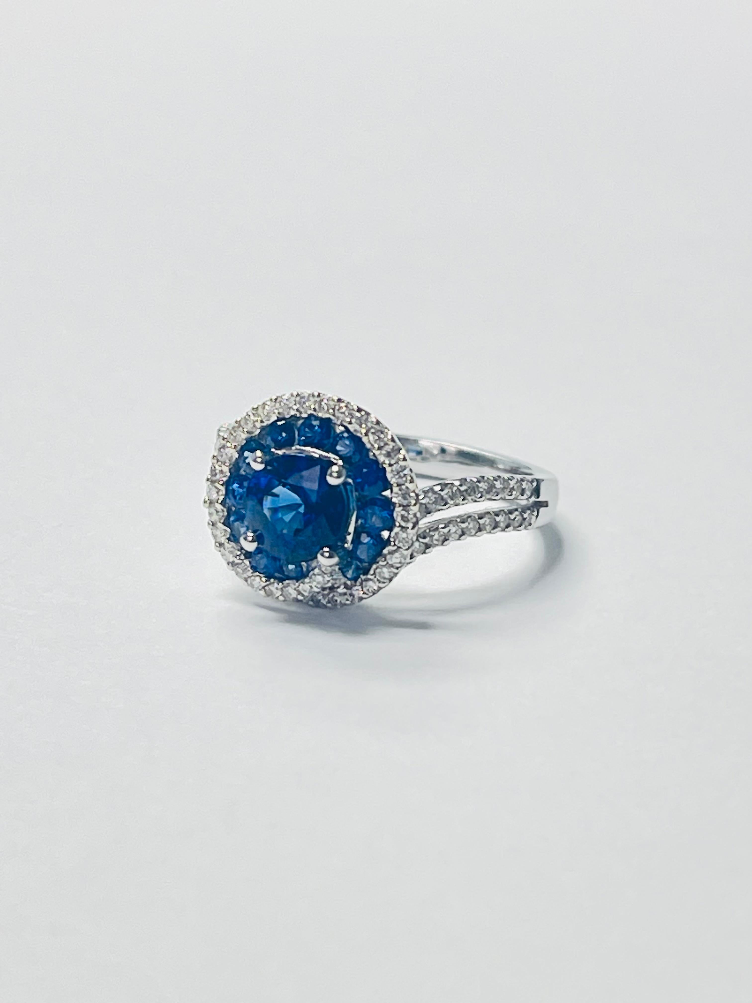 Blue Sapphire and Diamond ring beautifully handcrafted in 18k white gold. 
The details are as follows : 
Blue sapphire weight : 1.45 carat 
Diamond weight : 0.43 carat 
Metal : 18K white gold 
Measurements : ring head : 11.8mm by 12.3mm
Ring size : 6