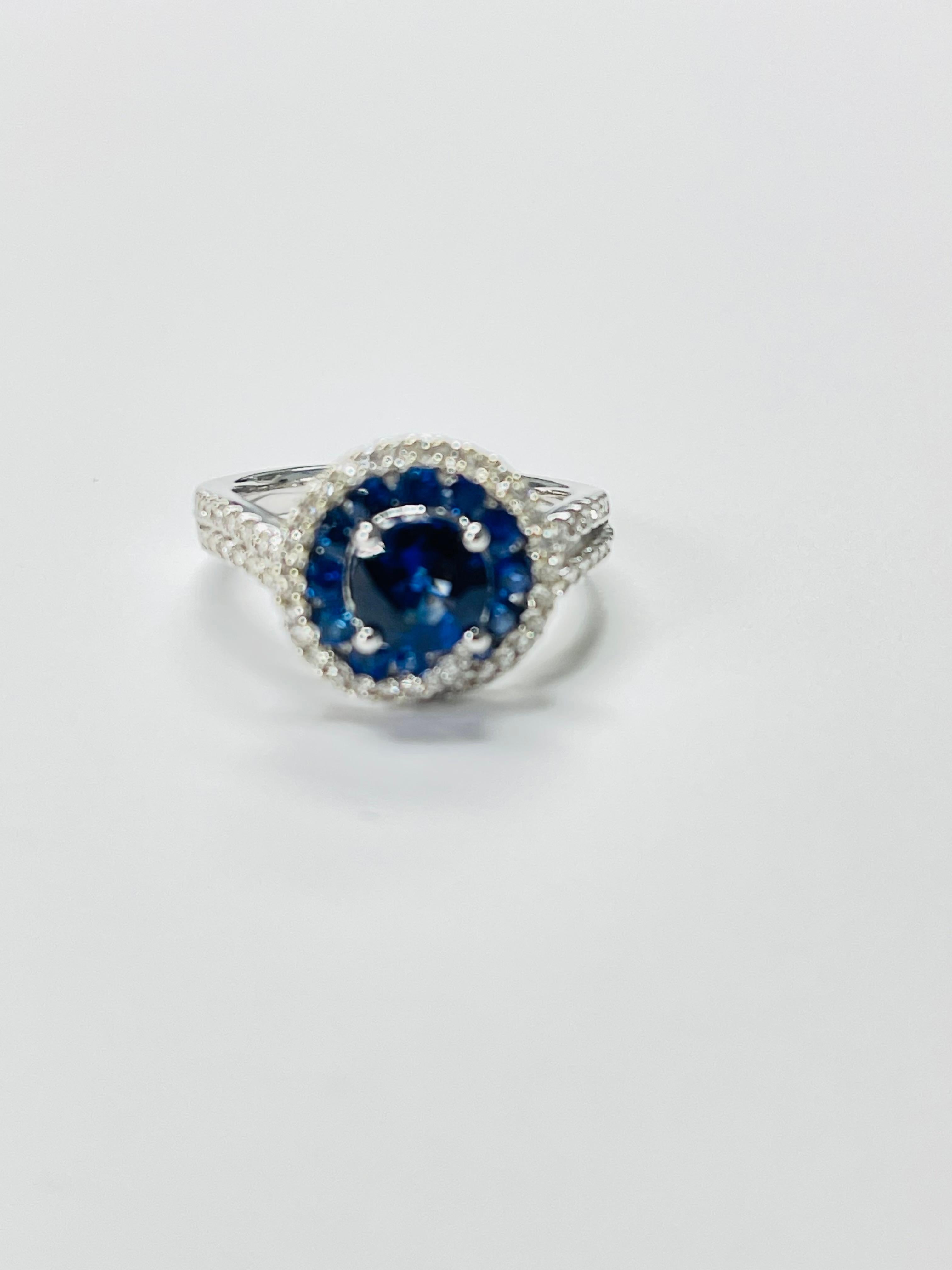 Round Cut Blue Sapphire and Diamond Engagement Ring In 18k White Gold. For Sale