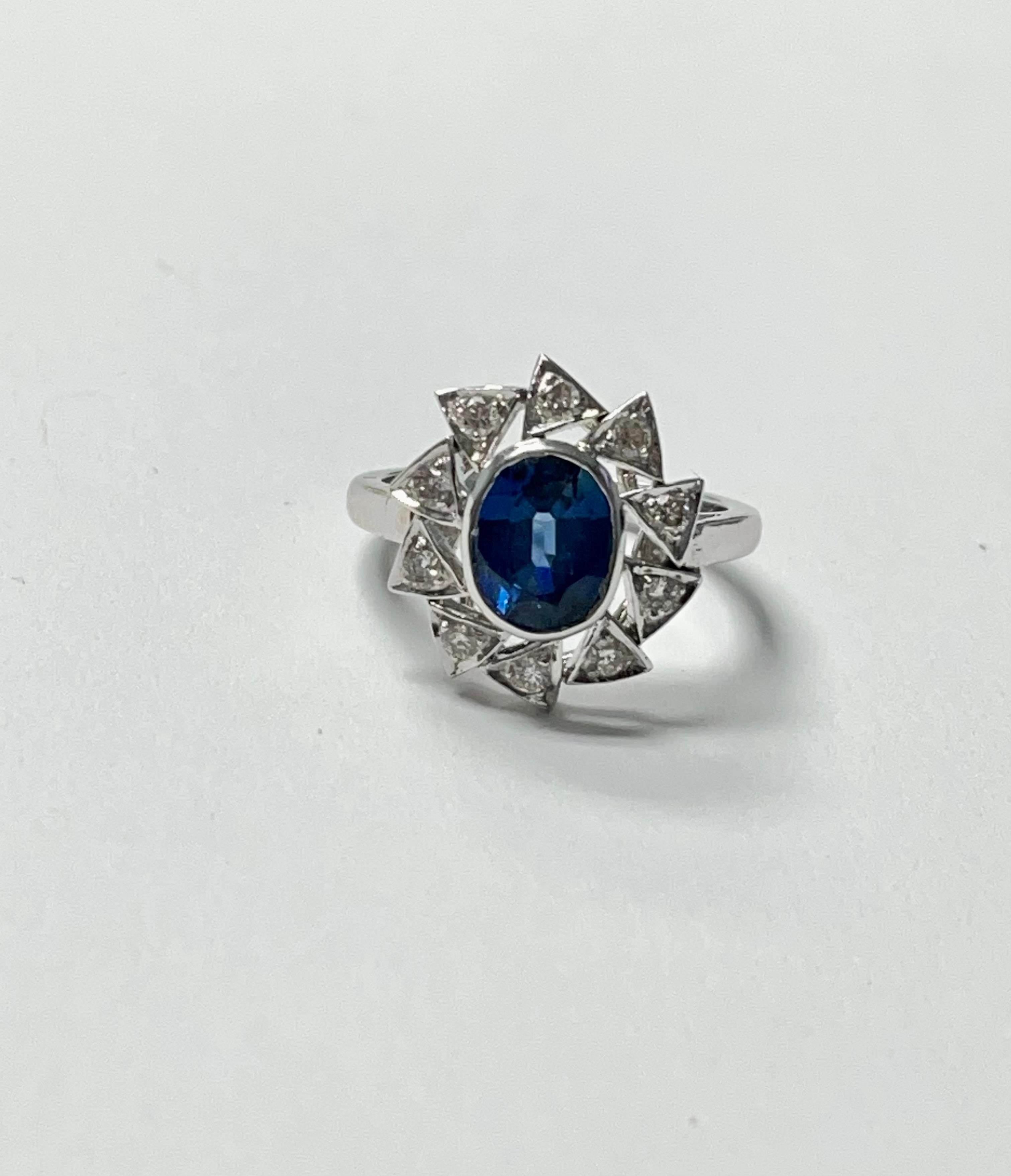 Oval Cut Blue Sapphire and Diamond Engagement Ring in 18K White Gold For Sale