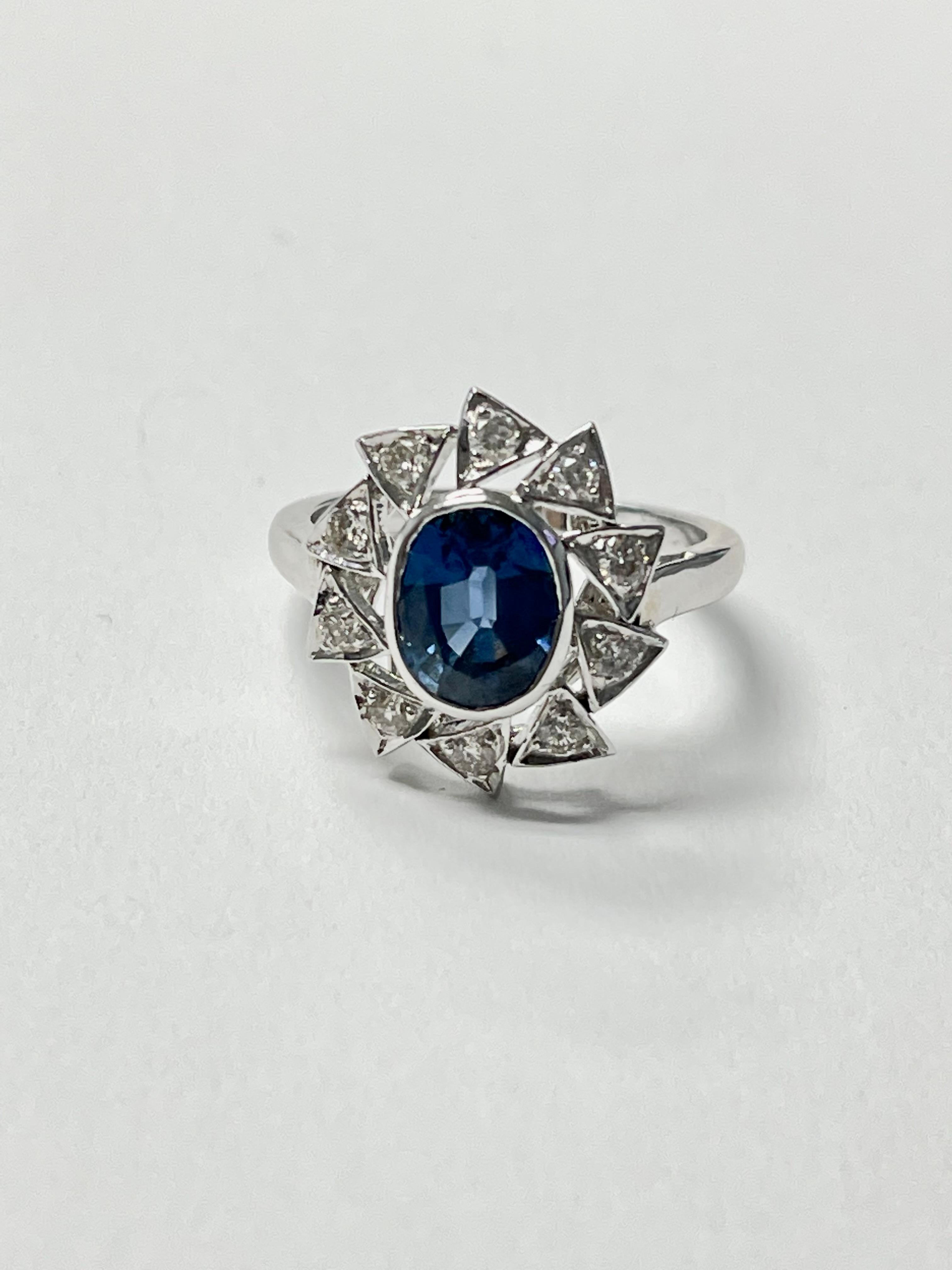 Blue Sapphire and Diamond Engagement Ring in 18K White Gold In Excellent Condition For Sale In New York, NY