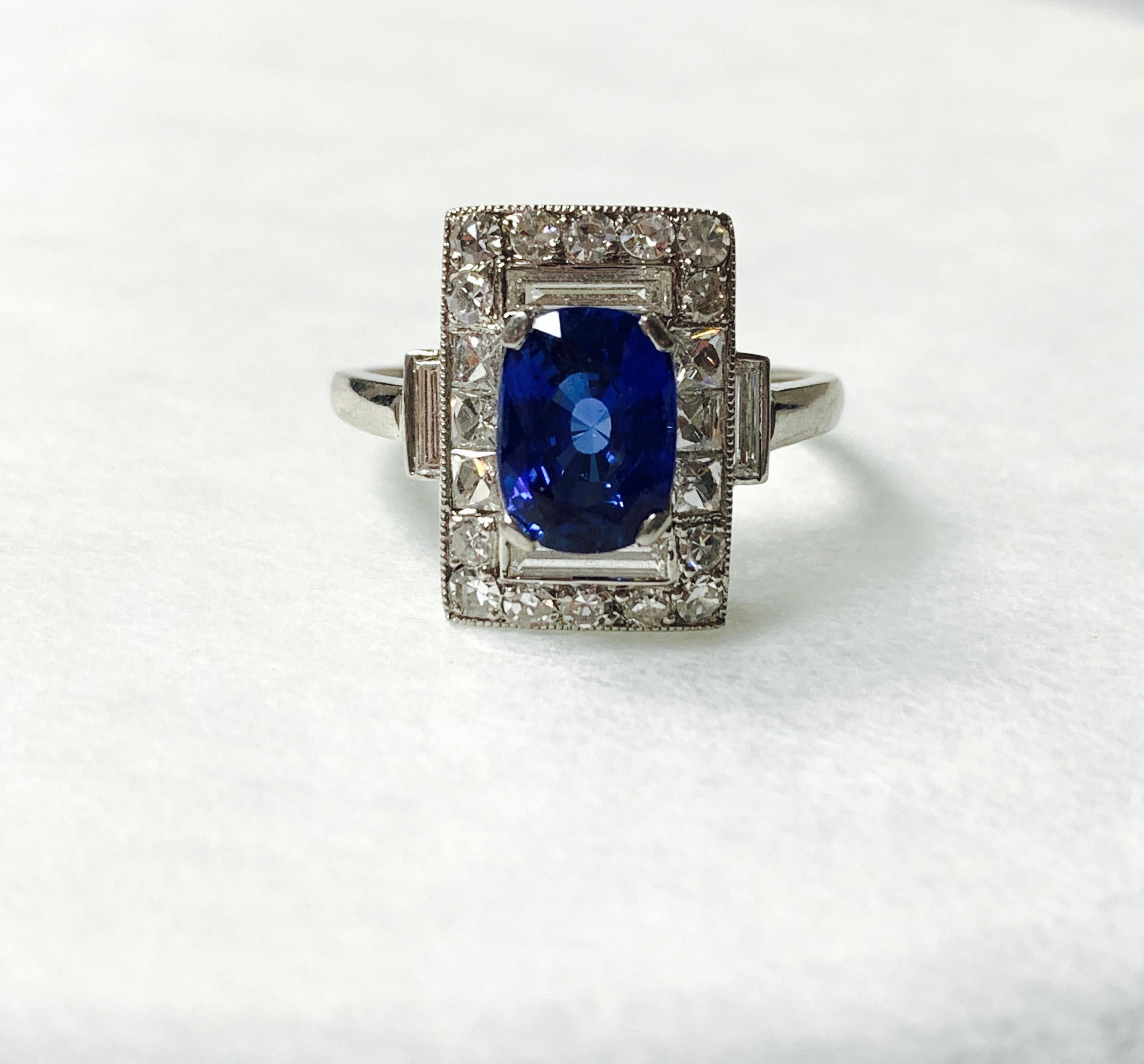 Moguldiam Inc blue sapphire and diamond engagement ring in platinum. 
blue sapphire weight : 2.02 carat 
diamond : 0.35 carat 
diamond baguettes : 0.65 carat 
metal : platinum 