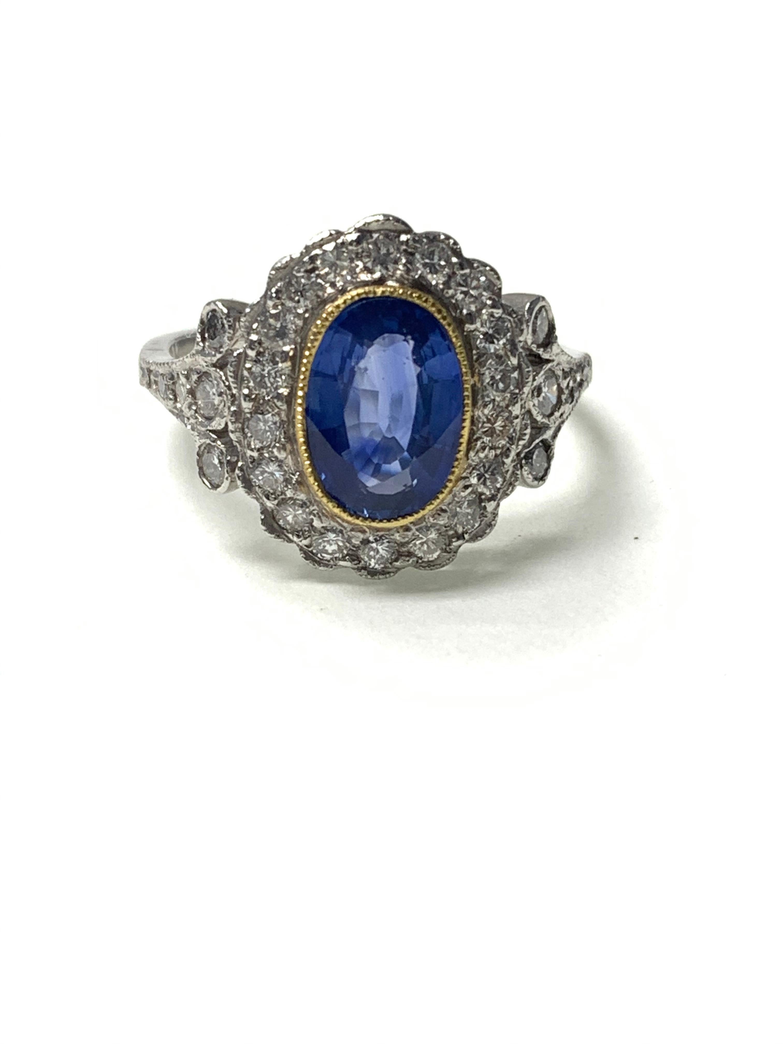 Blue sapphire and diamond engagement ring handcrafted in platinum. 
The details are as follows : 2.05 carat ( gorgeous blue color ) 
Diamond weight : 1.10carat ( GH color and VS clarity ) 
Dimensions : 15.2mm by 12.5 mm 
Metal : Platinum 
Ring size