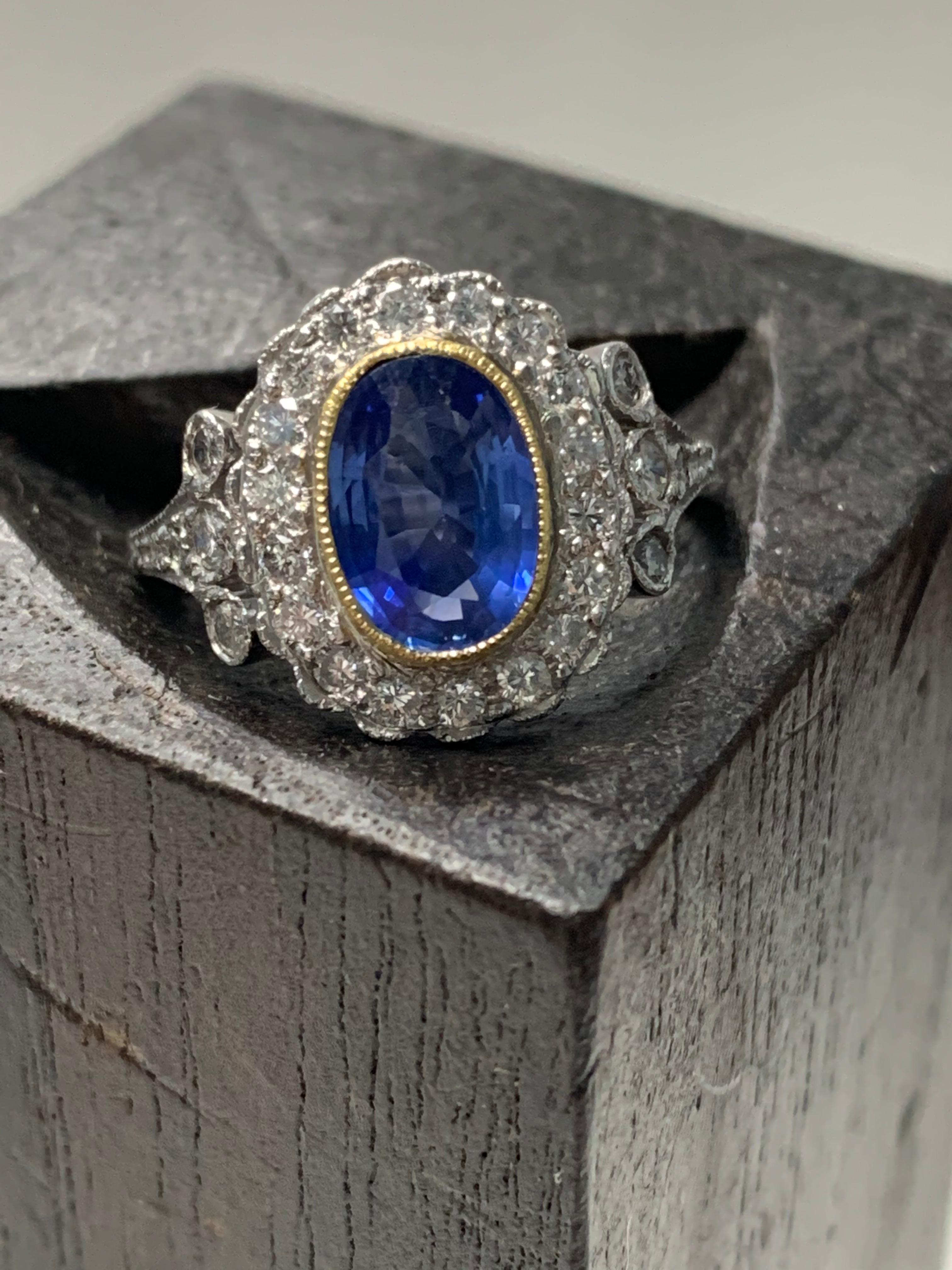 Oval Cut Blue Sapphire and Diamond Engagement Ring in Platinum