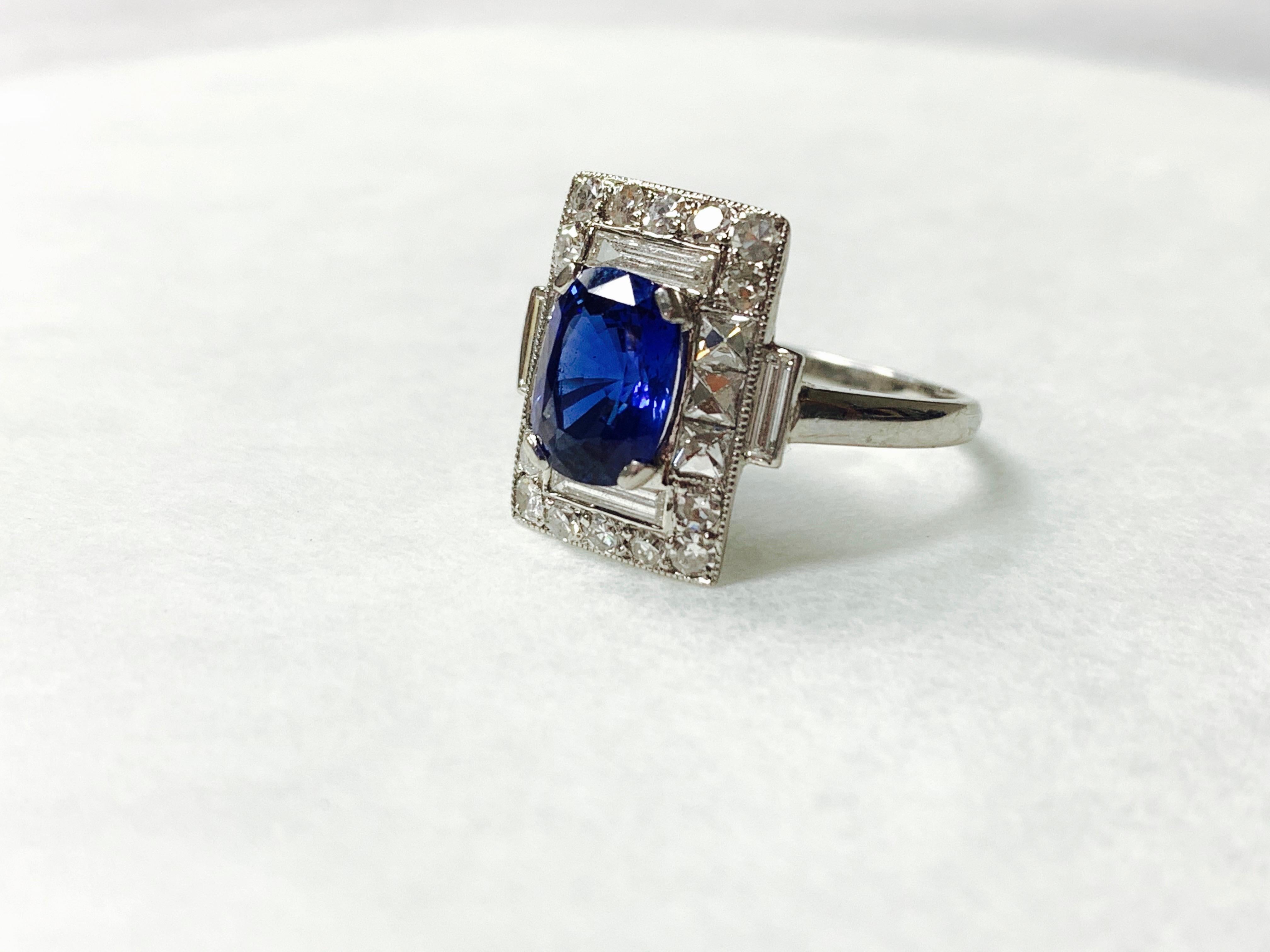 Contemporary Blue Sapphire and Diamond Engagement Ring in Platinum For Sale