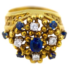 Blumenförmiger Ring mit blauem Saphir und Diamant