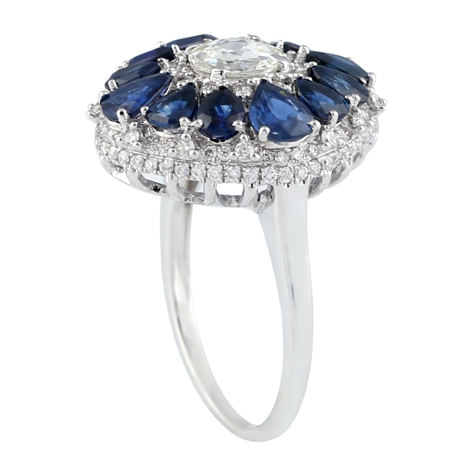 Designer Blue Sapphire and Diamond Floral Ring in 18K White Gold. 

Ring Size: 6.75 ( Can be sized )

18K Gold: 6.4gms
Diamond: 1.1cts
Blue Sapphire: 2.99cts