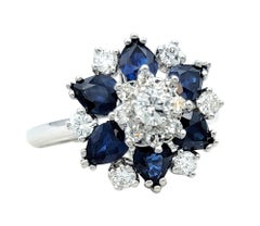 Blue Sapphire and Diamond Flower Motif Cocktail Ring Set in 14 Karat White Gold