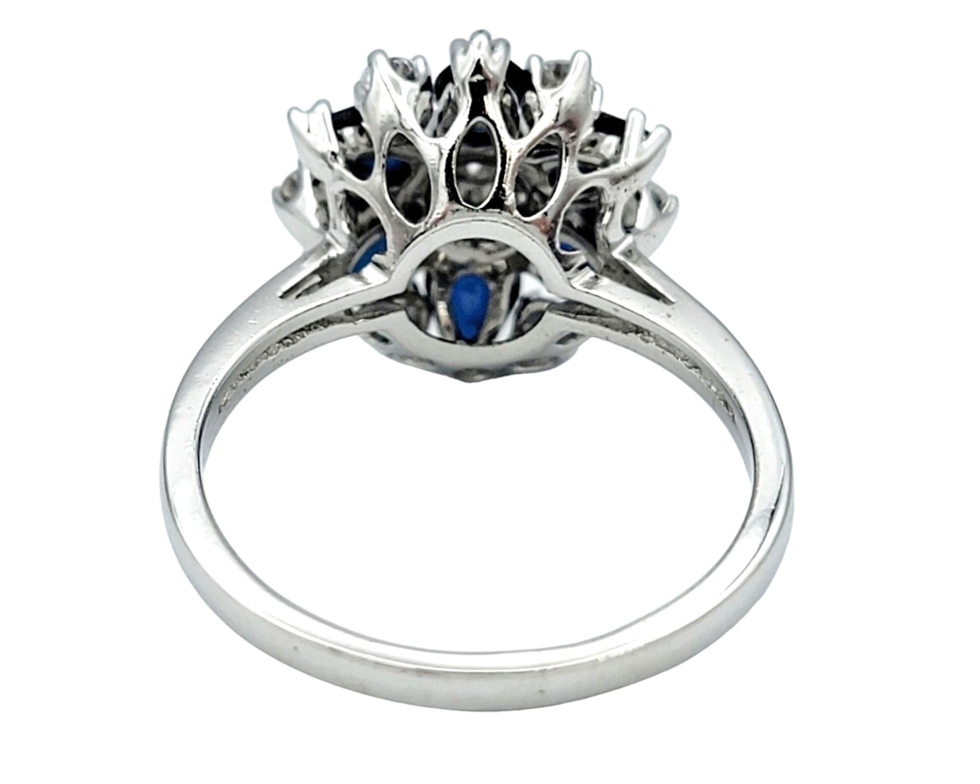Pear Cut Blue Sapphire and Diamond Flower Motif Cocktail Ring Set in 14 Karat White Gold For Sale