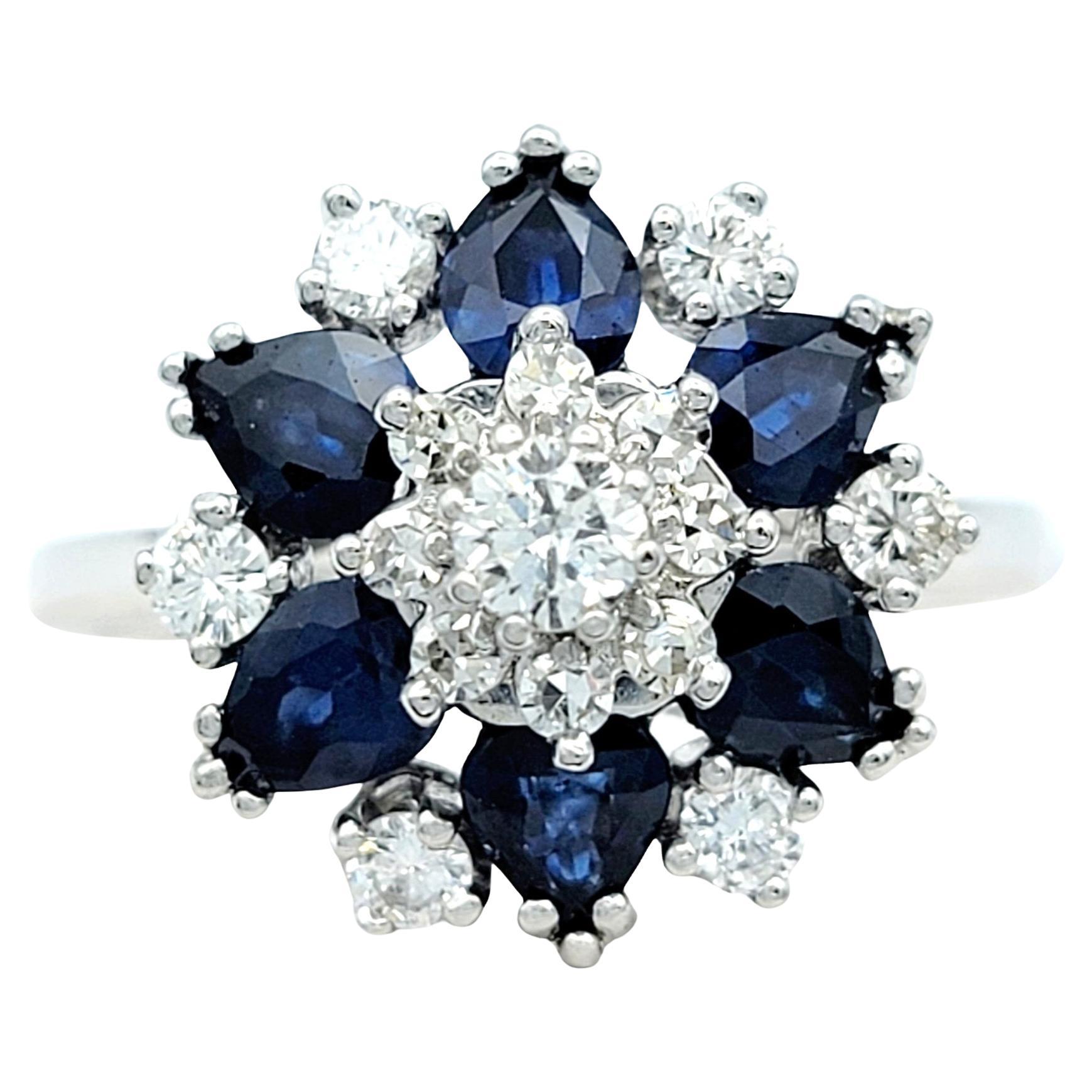 Blue Sapphire and Diamond Flower Motif Cocktail Ring Set in 14 Karat White Gold For Sale