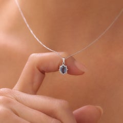 Blue Sapphire And Diamond Halo Necklace