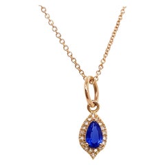 Blue Sapphire and Diamond Halo Pendant in 14 Karat Yellow Gold, Long Necklace