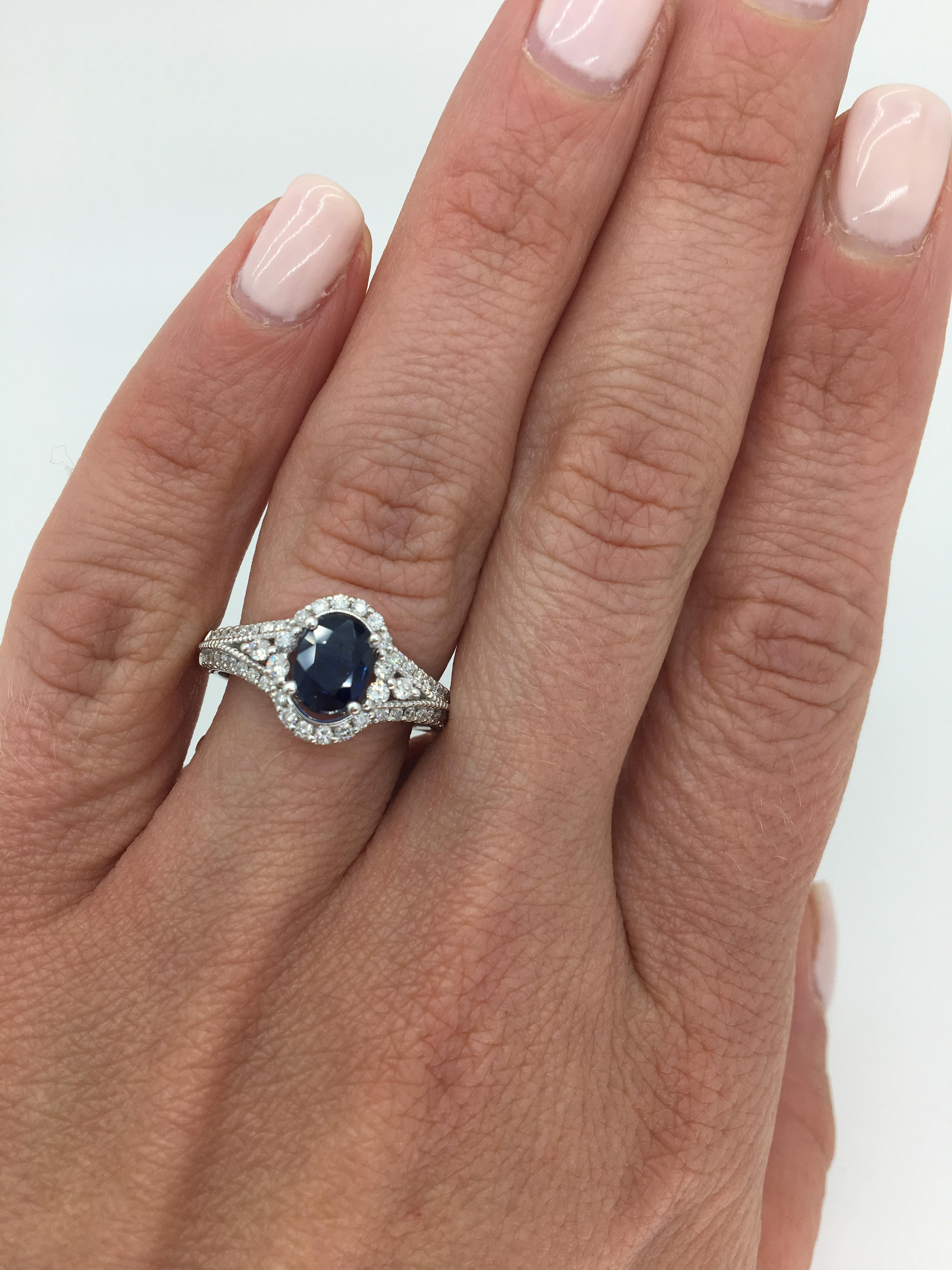 This stunning 1.12CT Blue Sapphire and Diamond ring has the perfect amount of elegance with its beautiful diamond halo and filigree detail.

 
Gemstone: Sapphire & Diamonds
Gemstone Carat Weight: 1.12CT Oval Cut Blue Sapphire
Diamond Carat Weight: