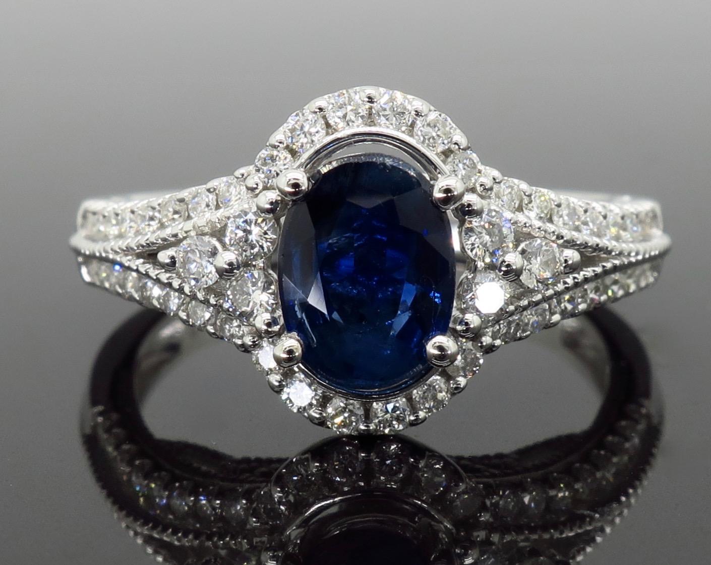 Oval Cut Blue Sapphire and Diamond Halo Ring