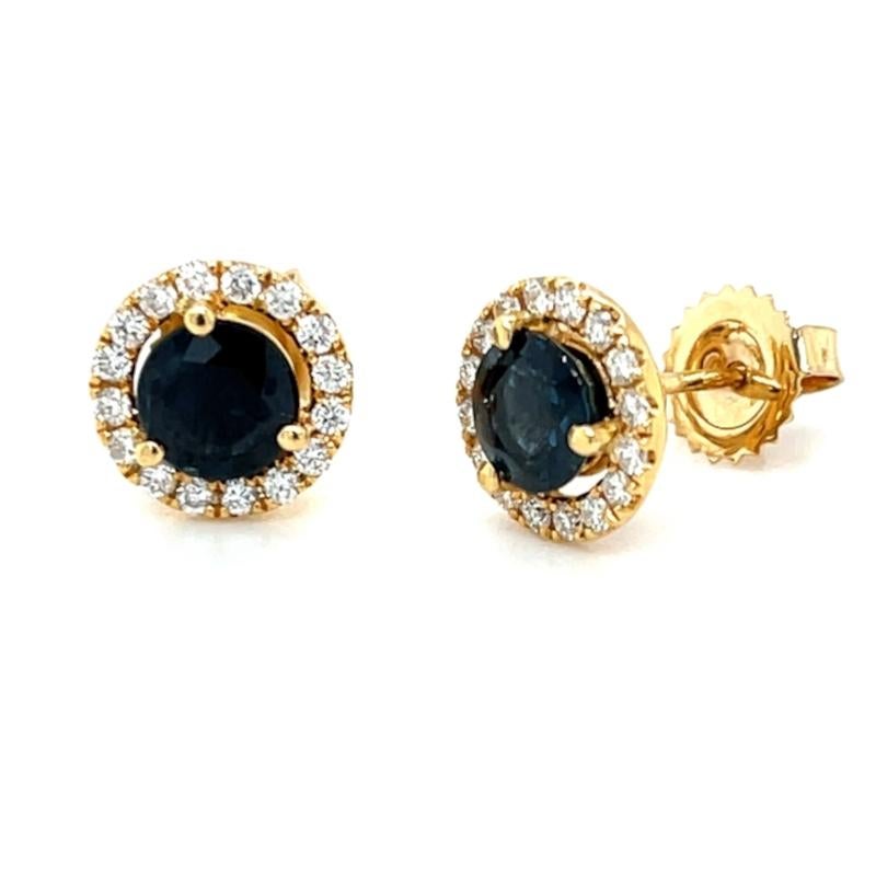 These gorgeous, deep blue sapphire studs are a must-have! Two blue sapphires are surrounded by a halo of sparkly, round brilliant cut diamonds. Handmade by our Master Jewelers in Los Angeles in 18k yellow gold. The perfect addition to any fine