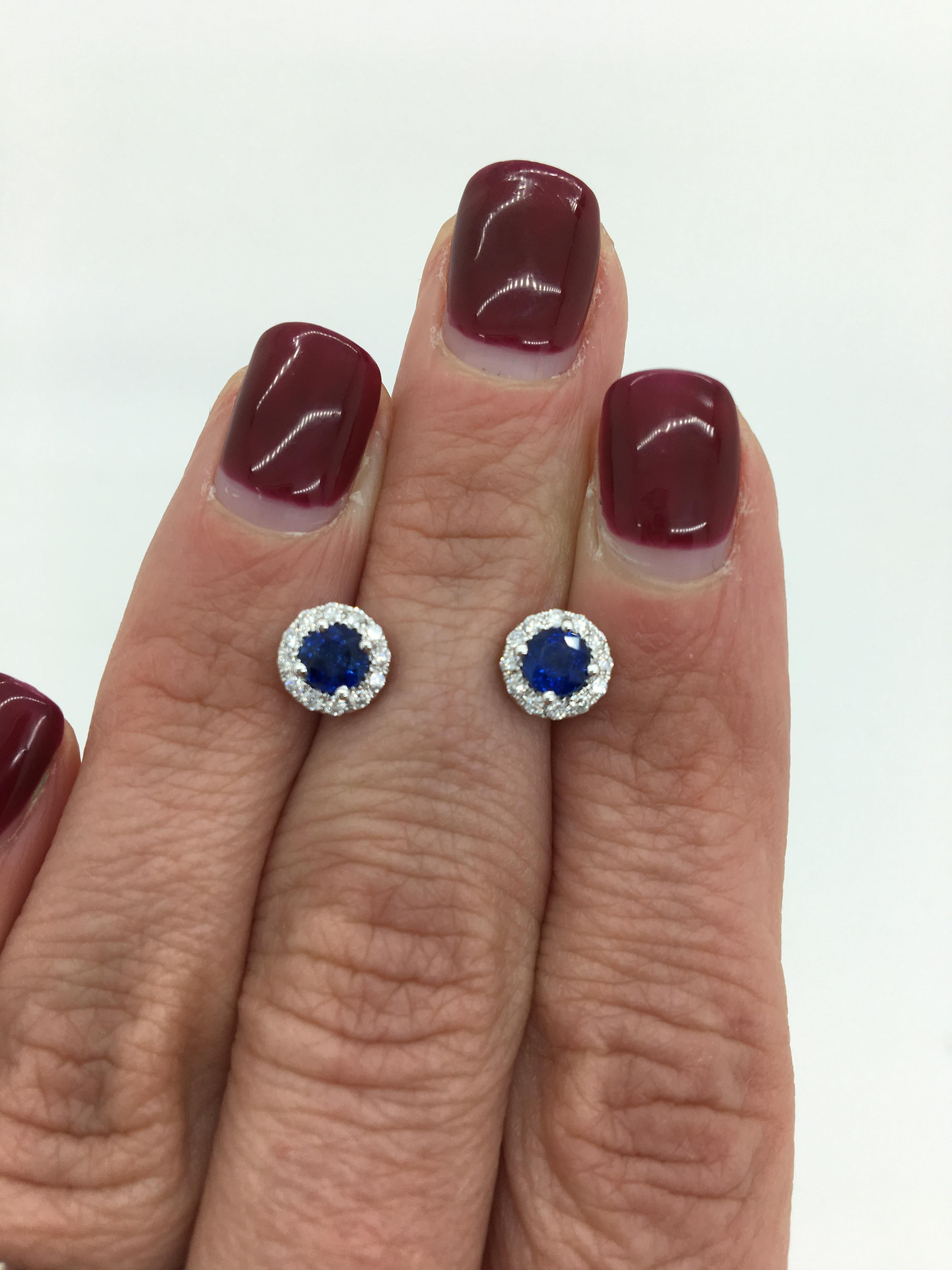 These halo style earrings feature two beautiful Blue Sapphires surrounded by .19CTW of Round Brilliant Cut Diamonds.

Gemstone: Diamond & Sapphire
Gemstone Carat Weight: .75CTW Round Cut Blue Sapphire
Diamond Carat Weight: Approximately