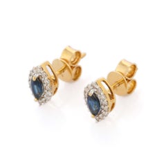 Blue Sapphire and Diamond Halo Stud Earrings in 18K Yellow Gold