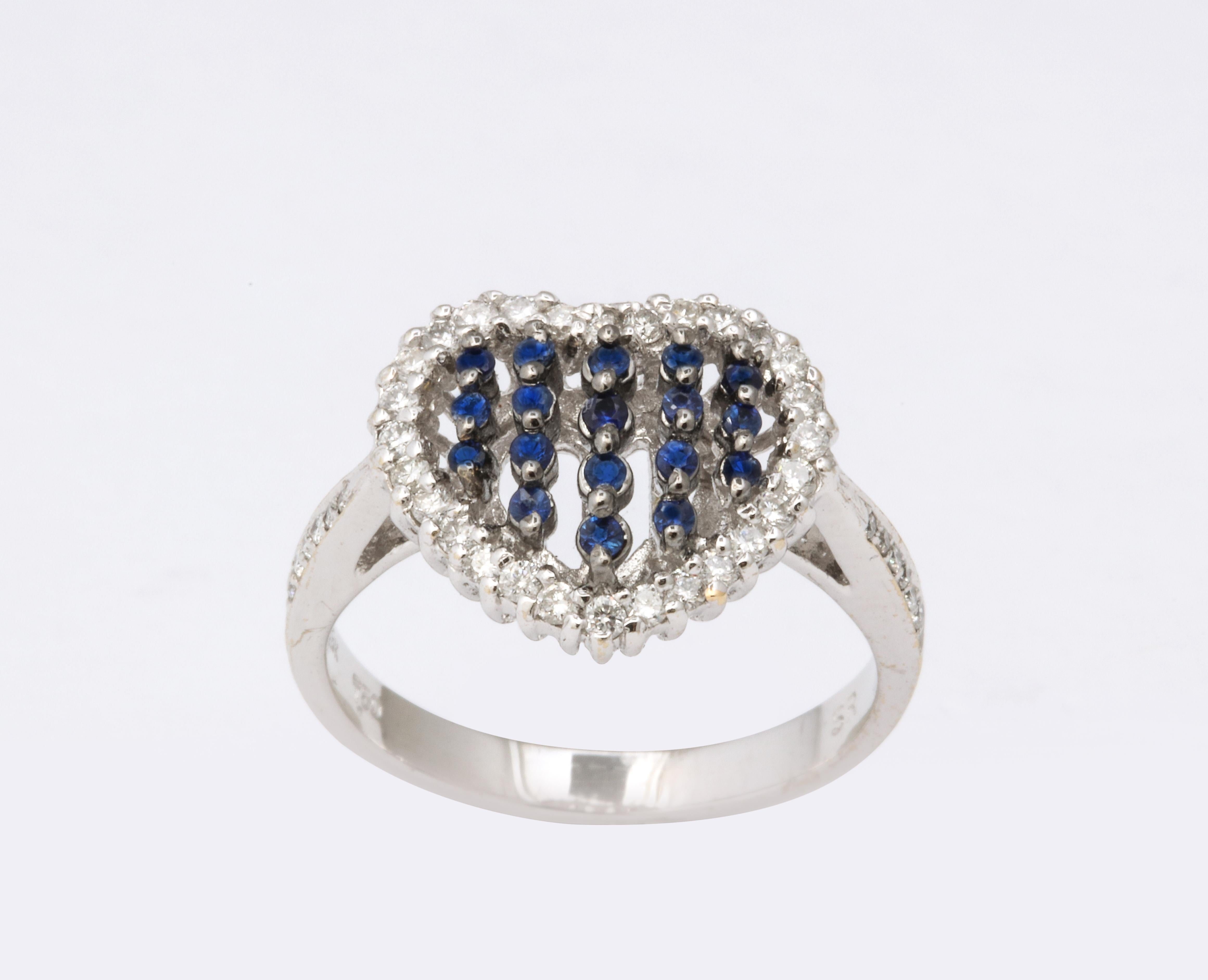 .21 carats of blue sapphire

.35 carats of whire diamonds

set in 18k white gold

The heart is just under 12 mm wide

Currently a 6.25, this ring can be sized to any finger size. 