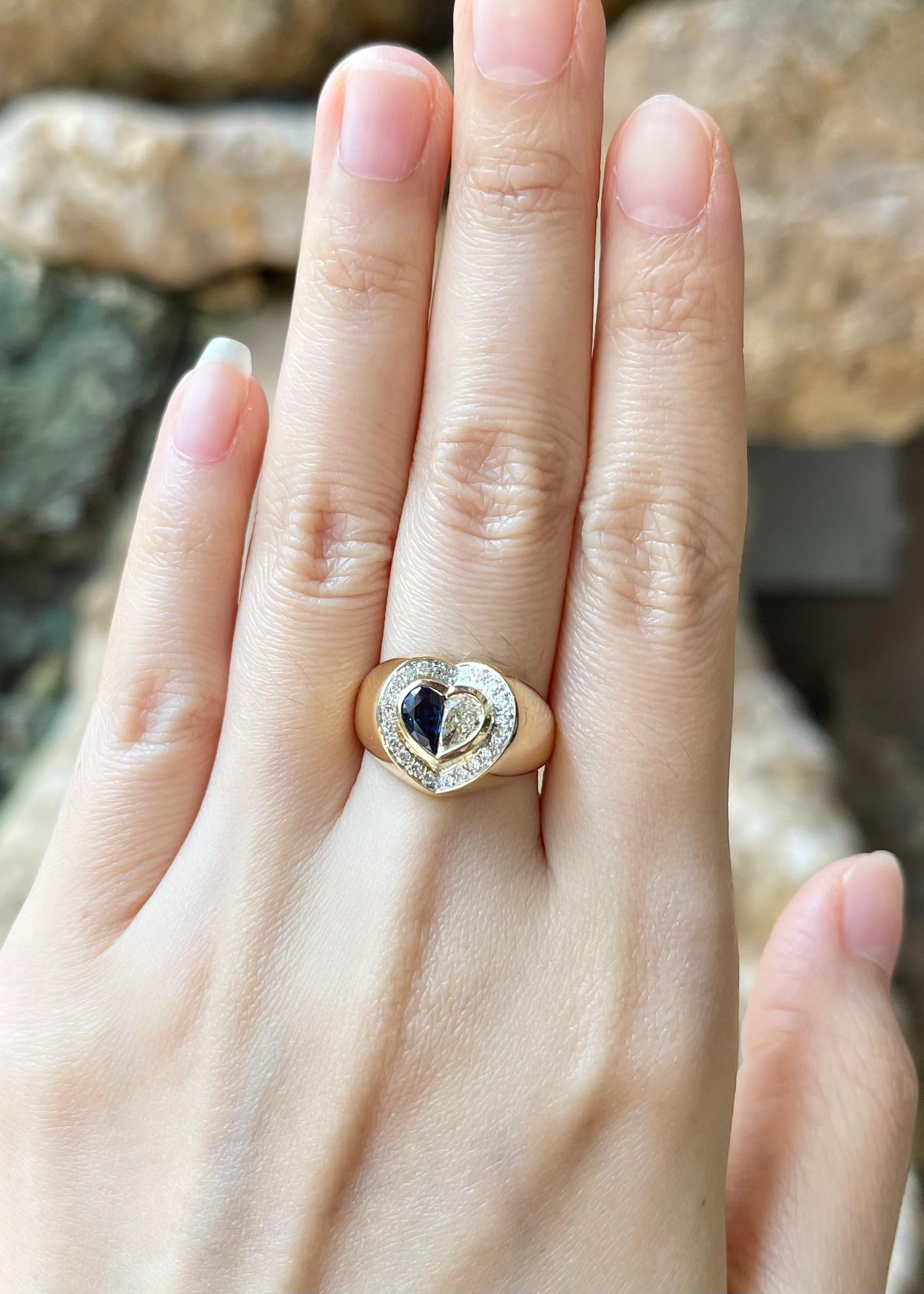 Contemporary Blue Sapphire and Diamond Heart Ring set in 18K Gold Settings For Sale
