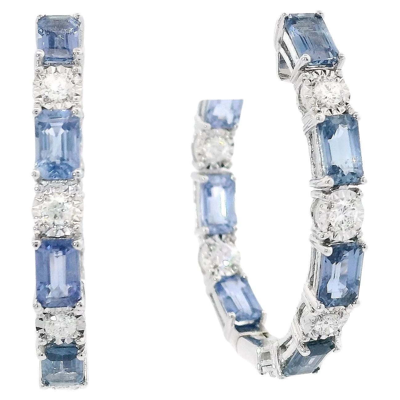 Discover the allure of sophistication with these stunning Sapphire and Diamond Hoop Earrings. Each piece is meticulously crafted, featuring a breathtaking sequence of light blue sapphires alternated with sparkling diamonds, set in a sleek hoop