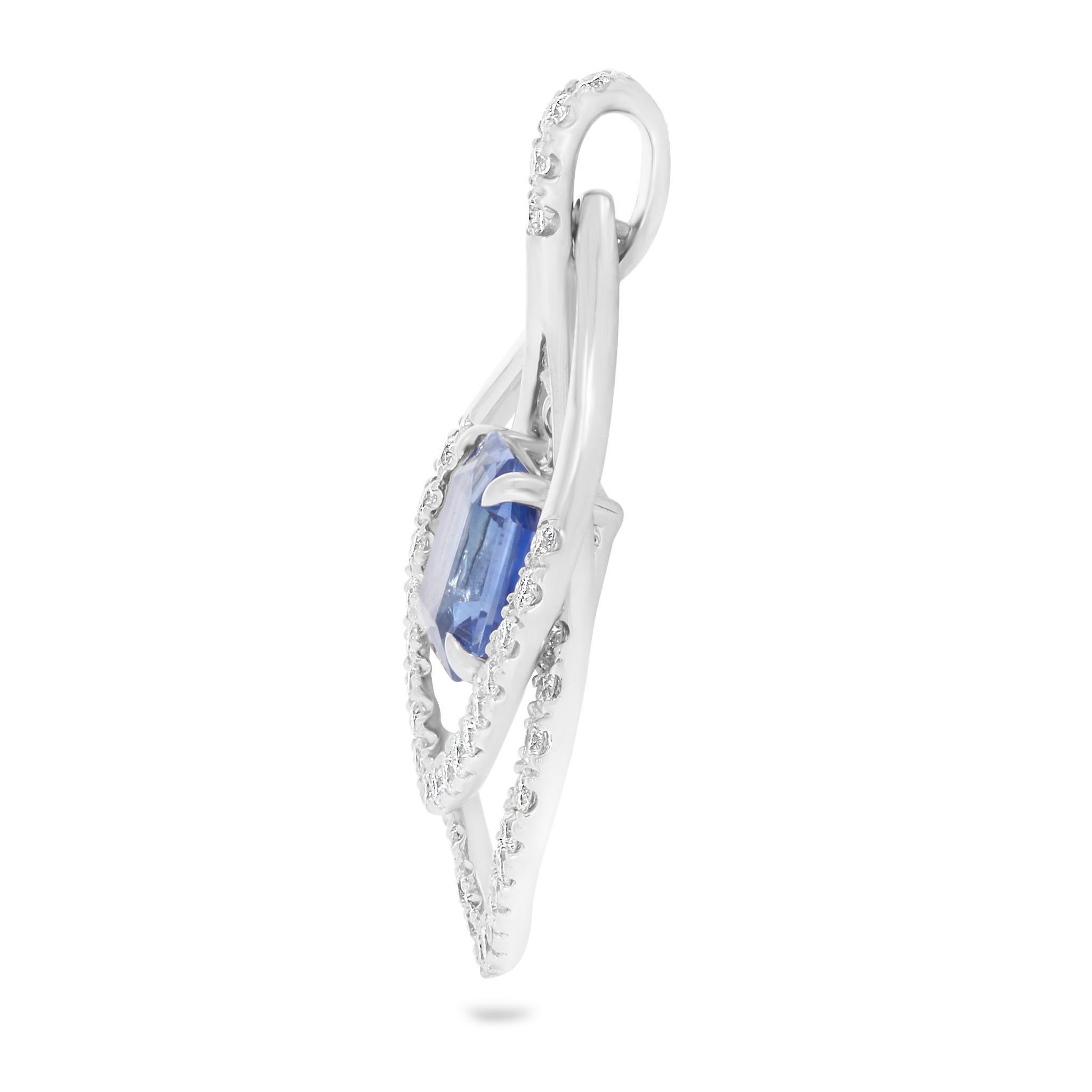 Indulge in the timeless allure of the Blue Sapphire and Diamond Kite Pendant.

• Exceptional 1.86ct emerald-cut blue sapphire
• 44 round brilliant G SI diamonds, 0.60ct total
• Articulated double diamond loop setting
• Diamond-set bail for a