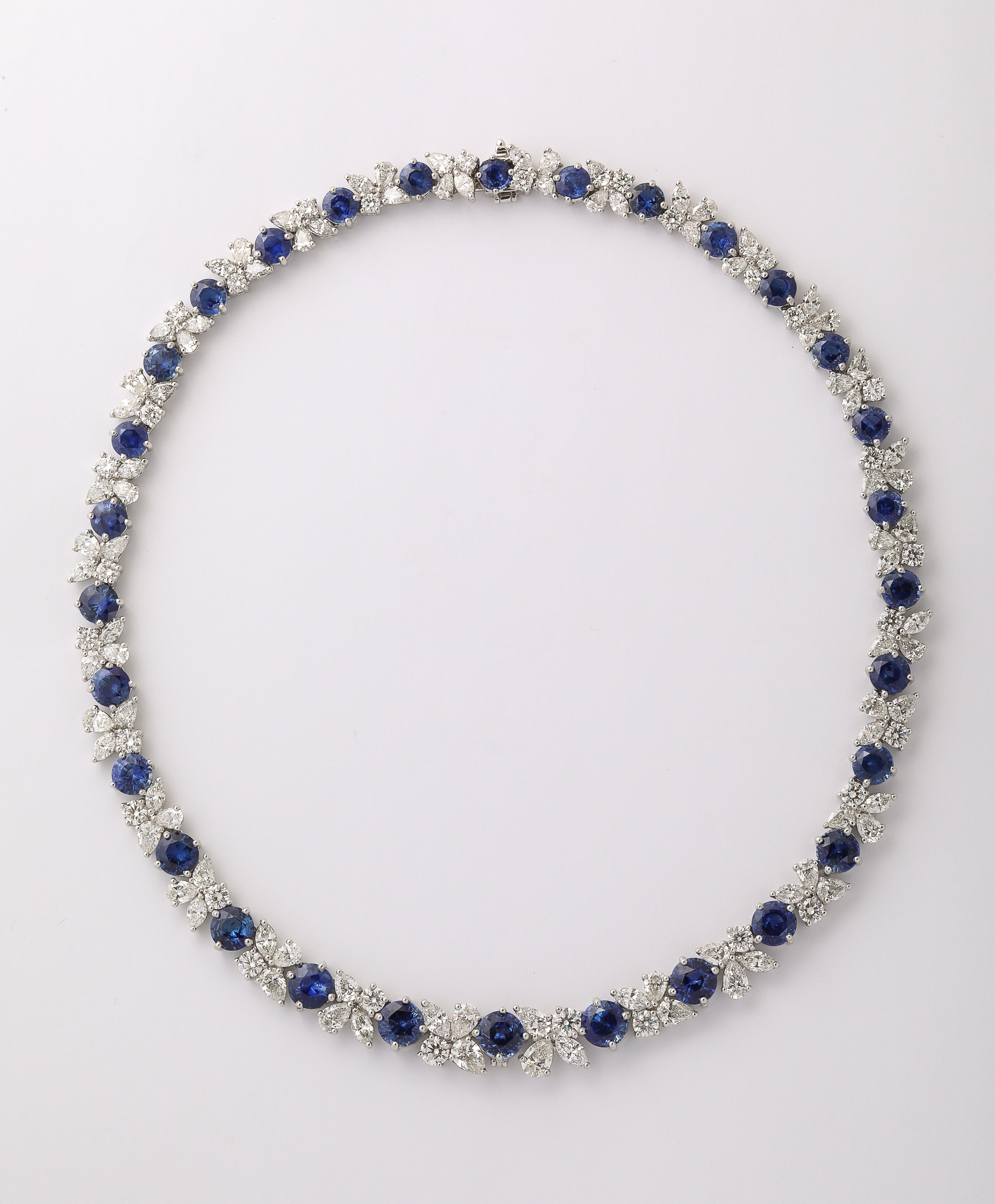 
A FABULOUS Blue Sapphire and Diamond Necklace. 

38.30 carats of certified Round Blue Sapphires. 

28.02 carats of white round brilliant and pear shaped diamonds. 

Set in platinum. 

A layout of round blue sapphires of this color and brilliance is
