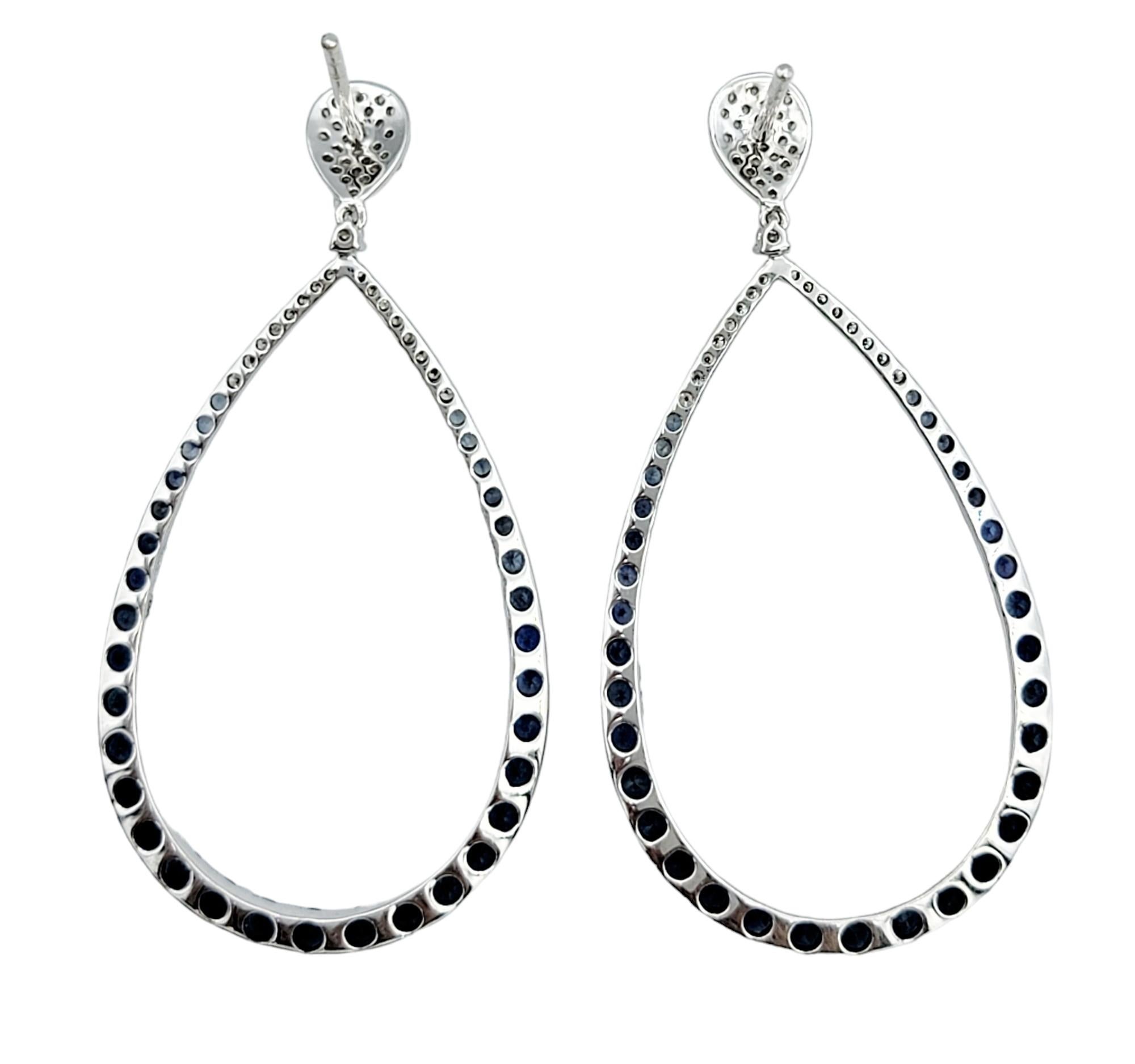 Round Cut Blue Sapphire and Diamond Open Teardrop Dangle Earrings in 14 Karat White Gold