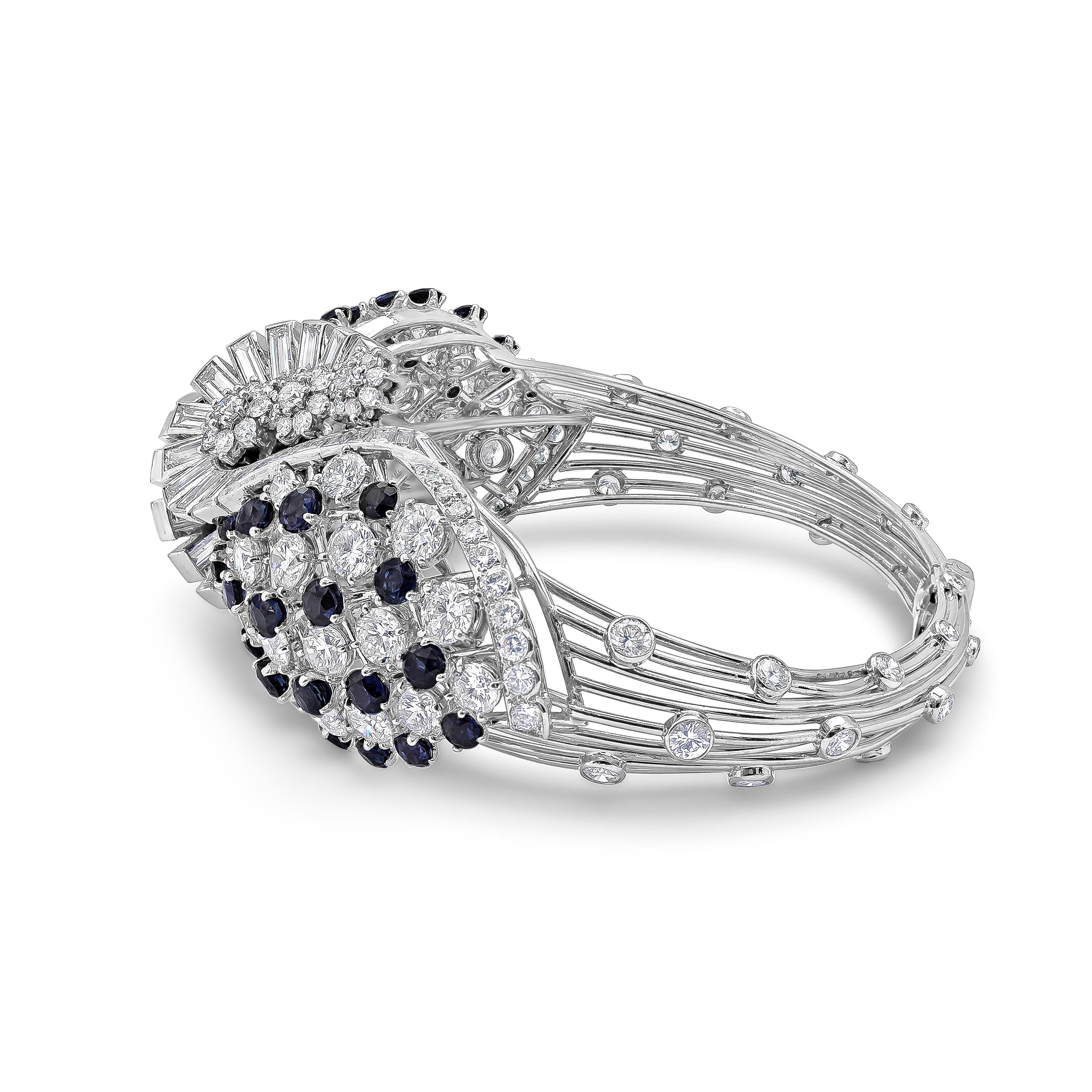 An intricately designed bracelet that is also collapsible to turn it into a brooch. Set with round brilliant and baguette diamonds weighing 20.04 carats total, accented by blue sapphires weighing 7.04 carats total. Made in 18k white gold.