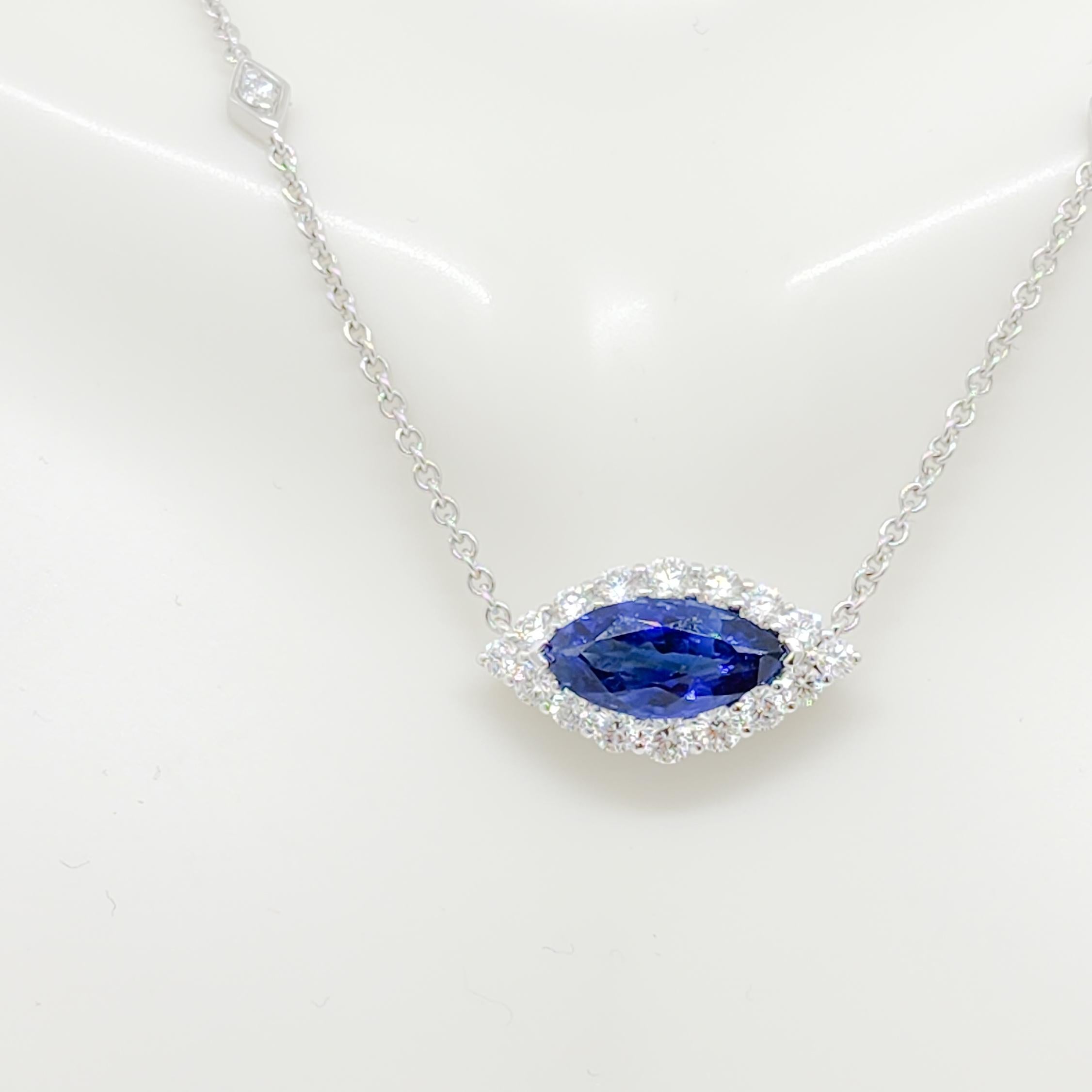 Gorgeous 2.62 ct. blue sapphire marquise with 0.87 ct. good quality white diamond rounds and marquise shapes.  Handmade in 18k white gold.  This necklace is a fun take on the 