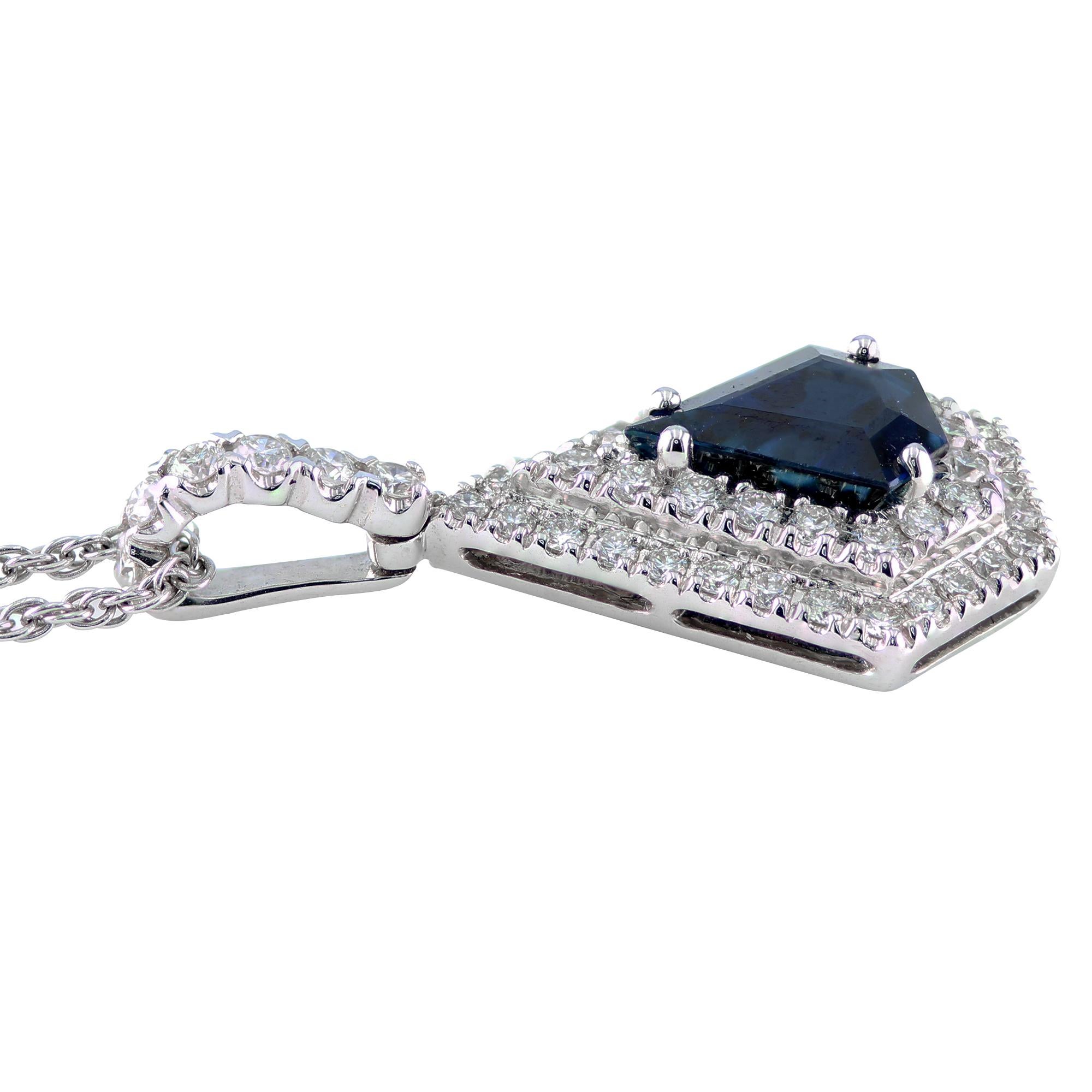 1.76 carat Kite-Shape Sapphire pendant, surrounded by 0.62 carat round diamonds, set in 18K.

Elegant pendant, that is sure to be an eye catching accessory to set a fun and classy mood at any occasion. 

18 inch long chain.