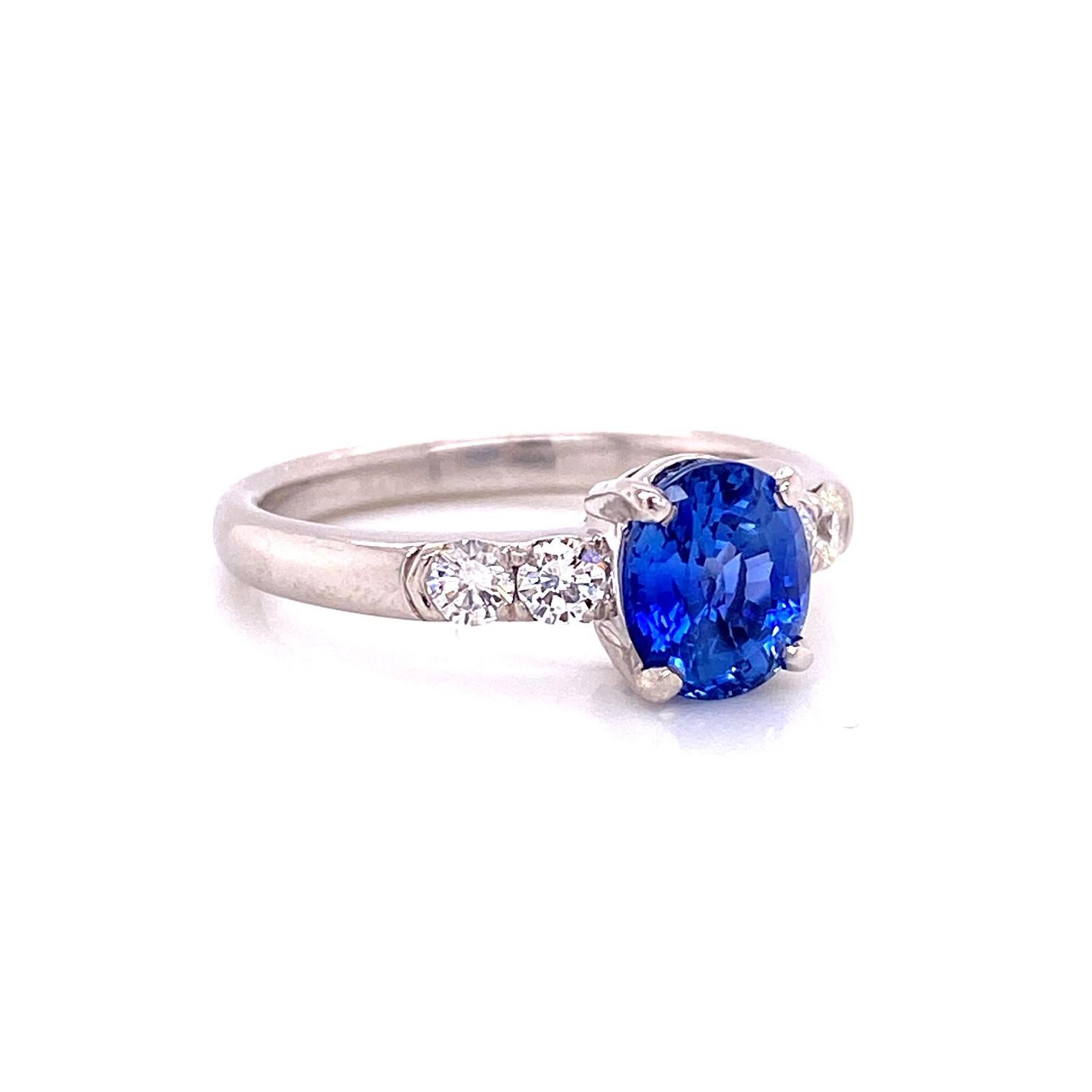 A ladies platinum ring set with an 1.60 carat oval sapphire and 0.29 total carat weight white diamonds, F color VS clarity. Ring size 6.5.
Model shown with Blue Sapphire Baguette Band, sold separately.
