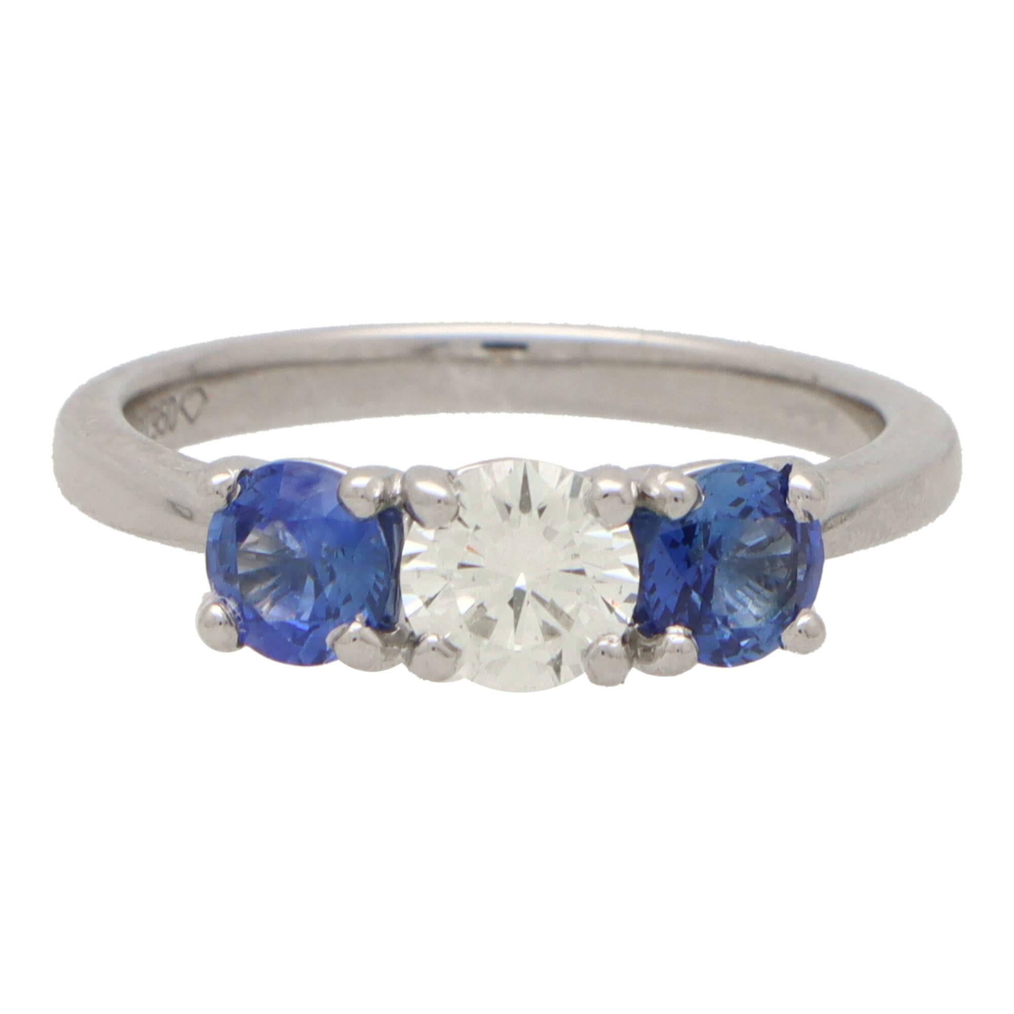 Modern Blue Sapphire and Diamond Reverse Three Stone Ring Set in Platinum For Sale