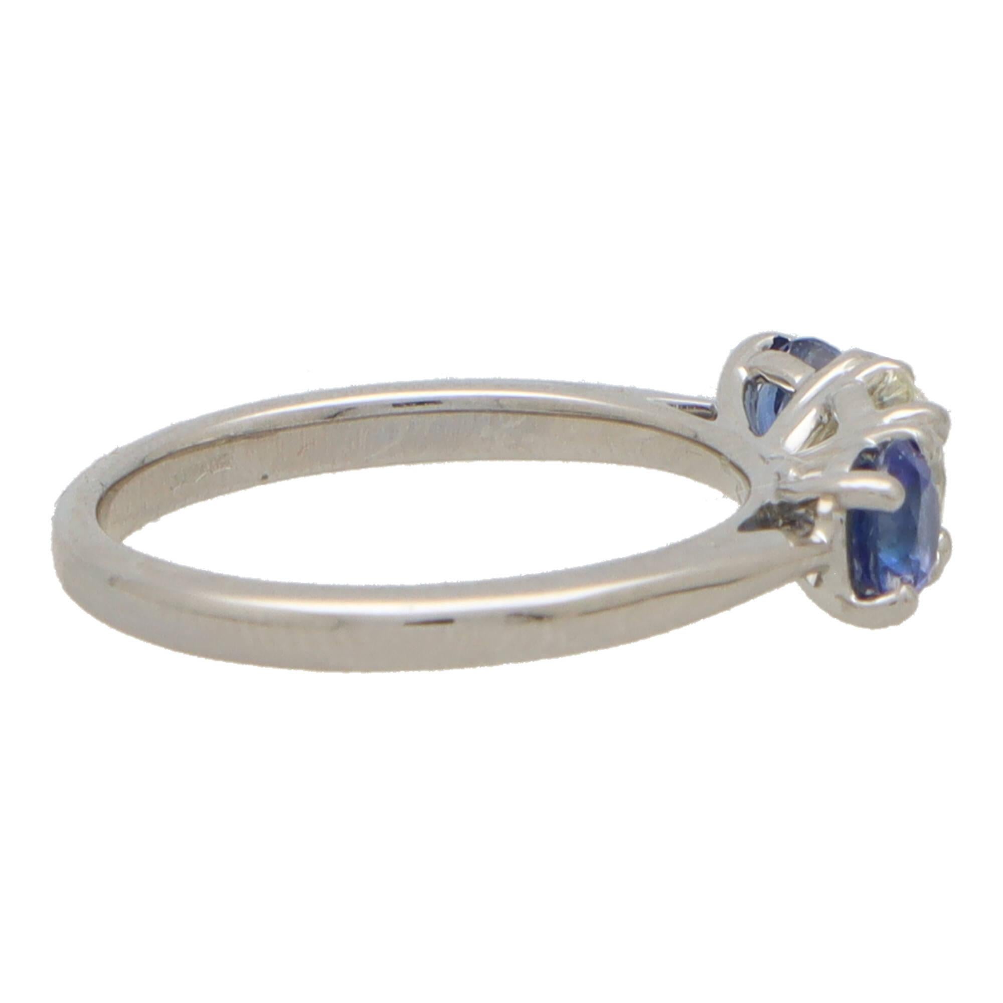 Blue Sapphire and Diamond Reverse Three Stone Ring Set in Platinum In New Condition For Sale In London, GB