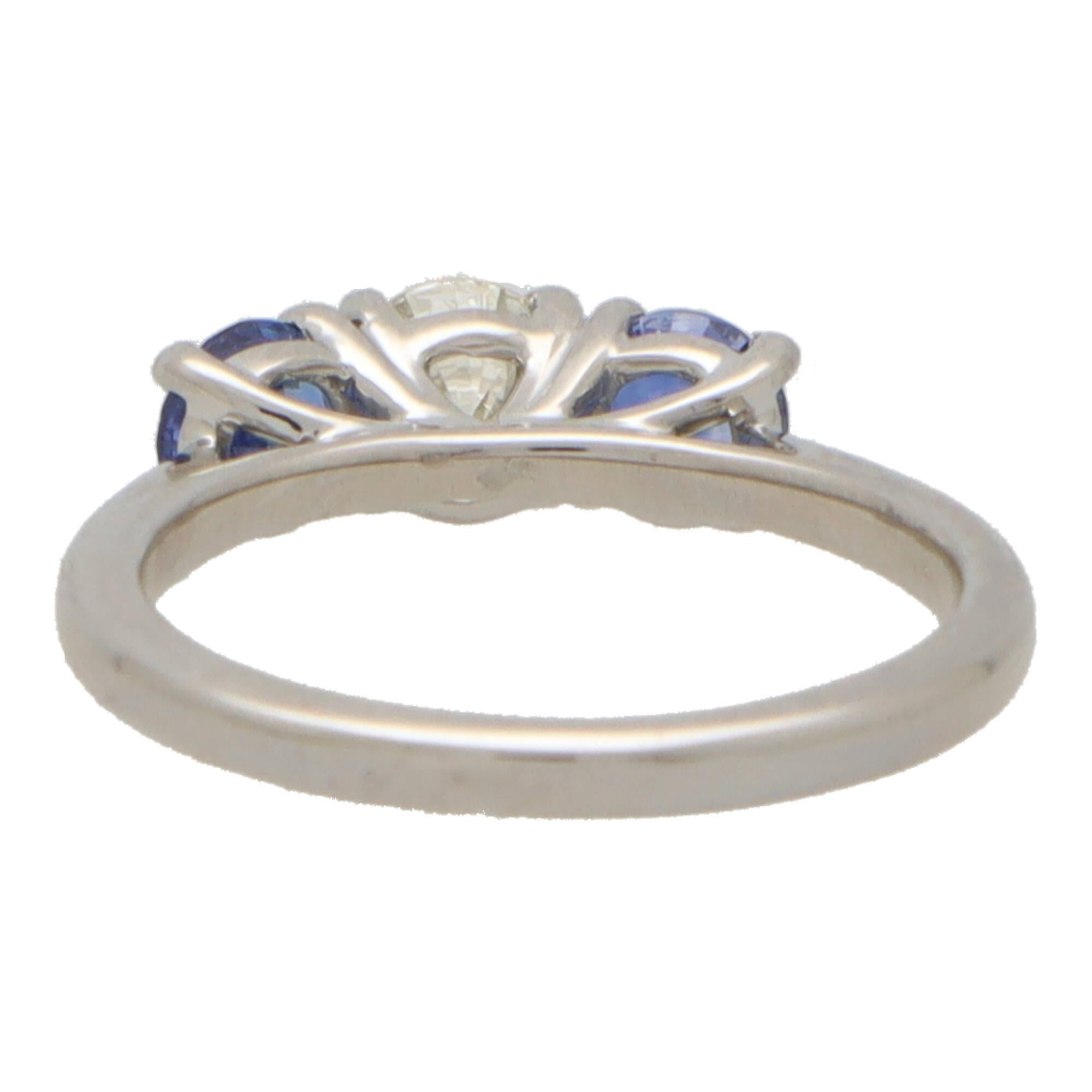 Women's or Men's Blue Sapphire and Diamond Reverse Three Stone Ring Set in Platinum For Sale