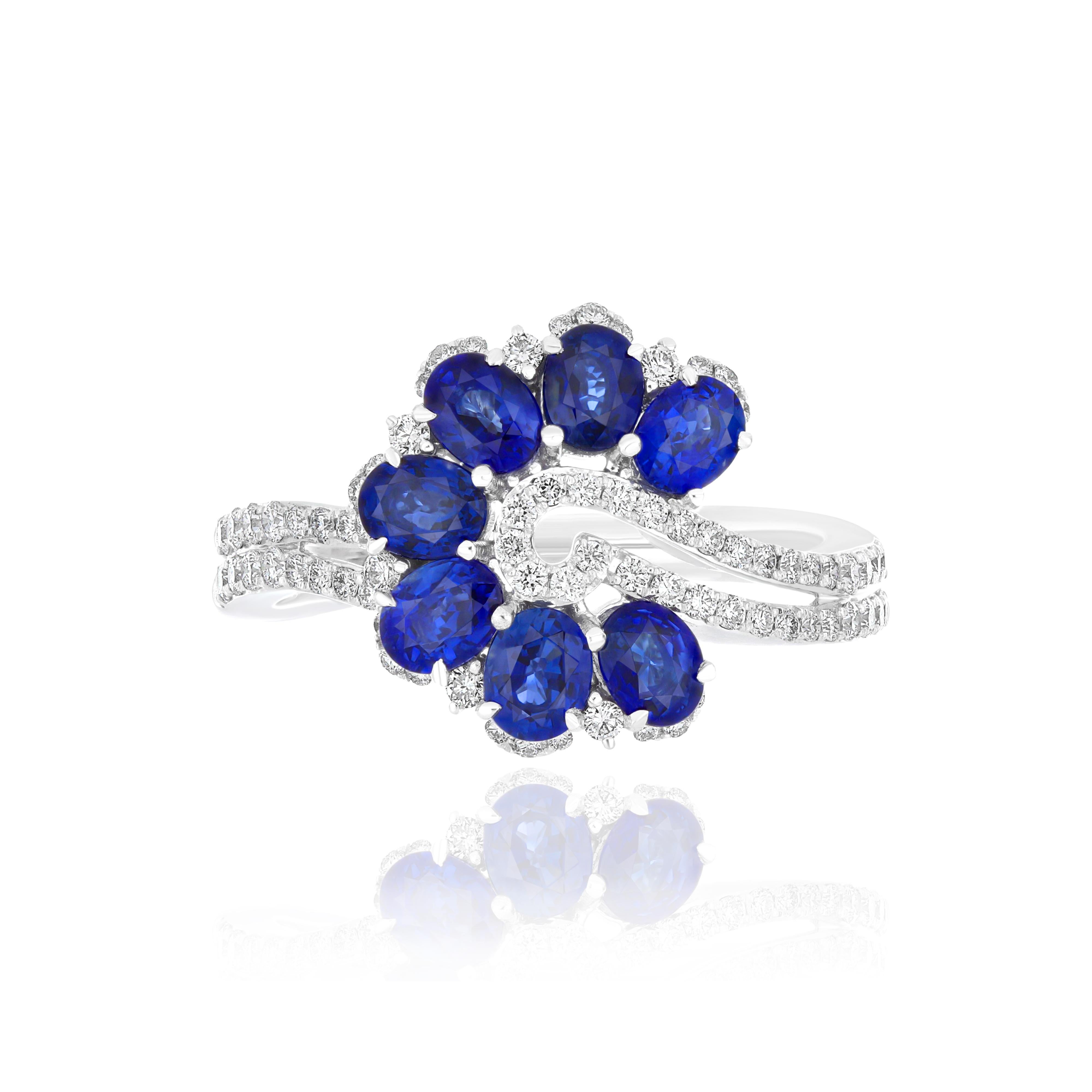 Elegant and exquisitely detailed 18 Karat White Gold Ring, center set with 1.81Cts. Oval Shape Blue Sapphire and micro pave set Diamonds, weighing approx. 0.42Cts Beautifully Hand crafted in 18 Karat White Gold.

Stone Detail:
Blue Sapphire: