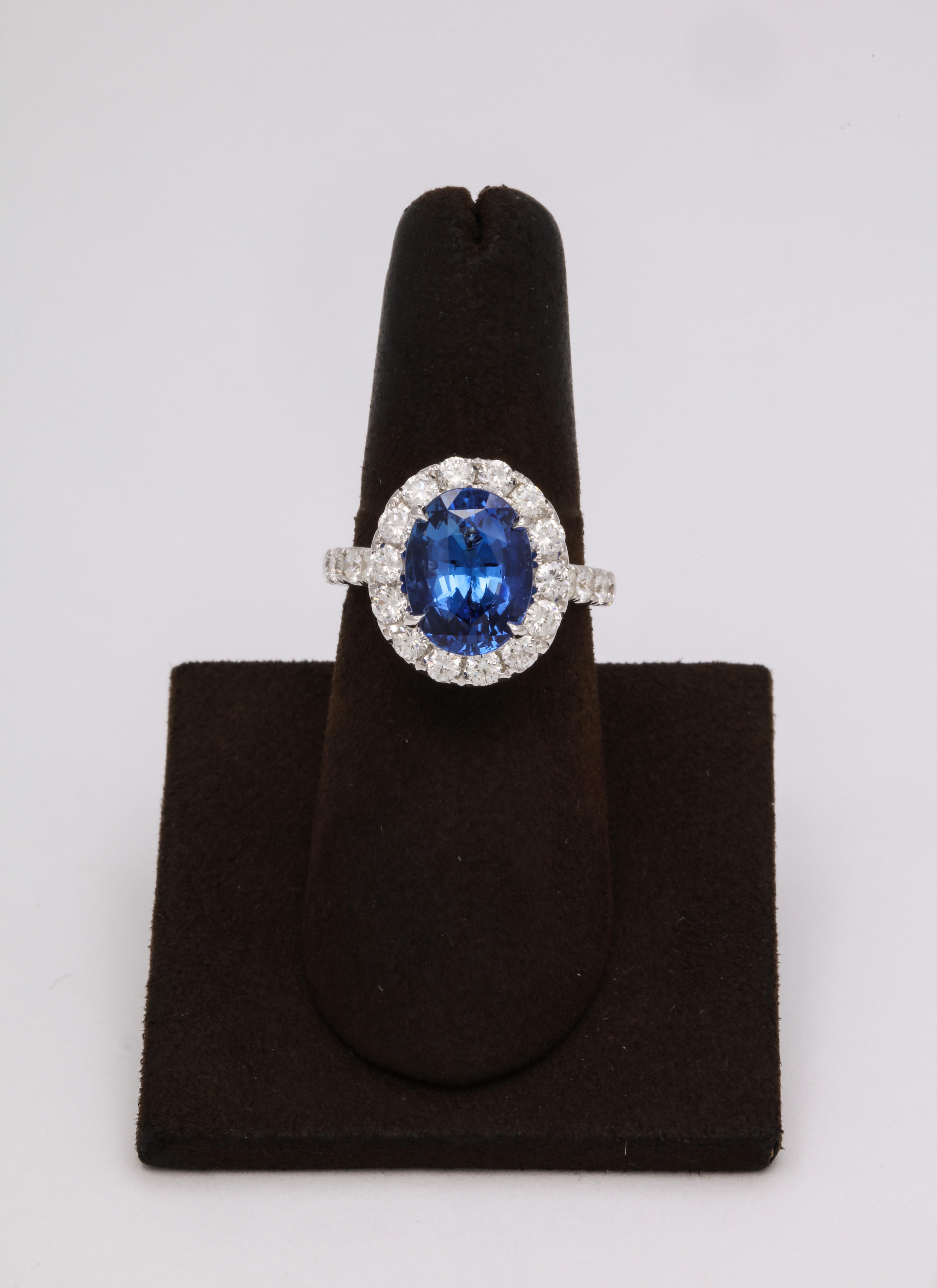 
Beautiful Ceylon Sapphire!!

5.20 carat vibrant blue sapphire -- full of life! 

Set in a wearable diamond mounting. 

1.64 carats of white round brilliant cut diamonds.

The mounting features unique diamond detail and engraving.

Currently a size