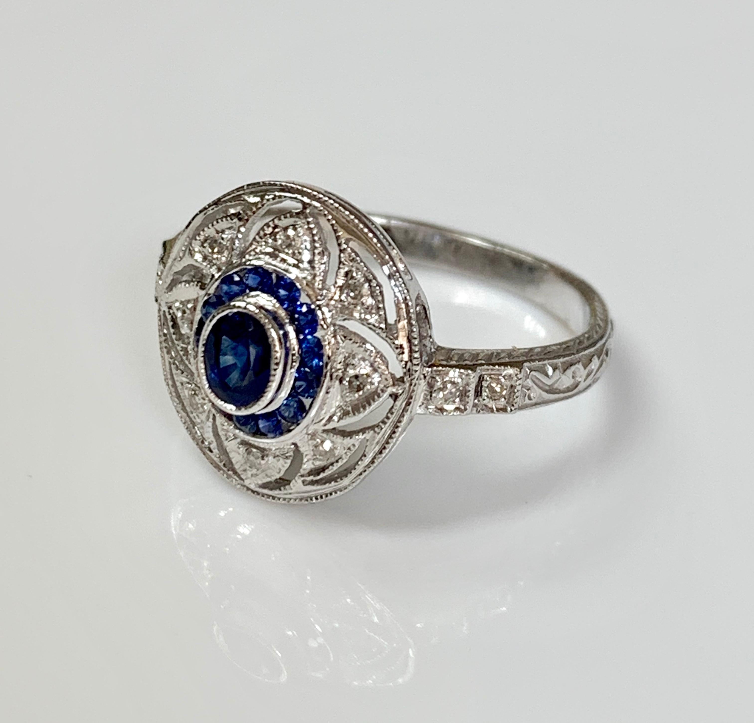 Blue Sapphire and diamond ring handcrafted in 14k white gold. 
The details are as follows : 
Blue Sapphire : 0.48 carat 
Diamond weight : .08 carat 
Metal : 14 K white gold 
Measurements( ring head )  : 0.40 inch by 0.30 inch 
