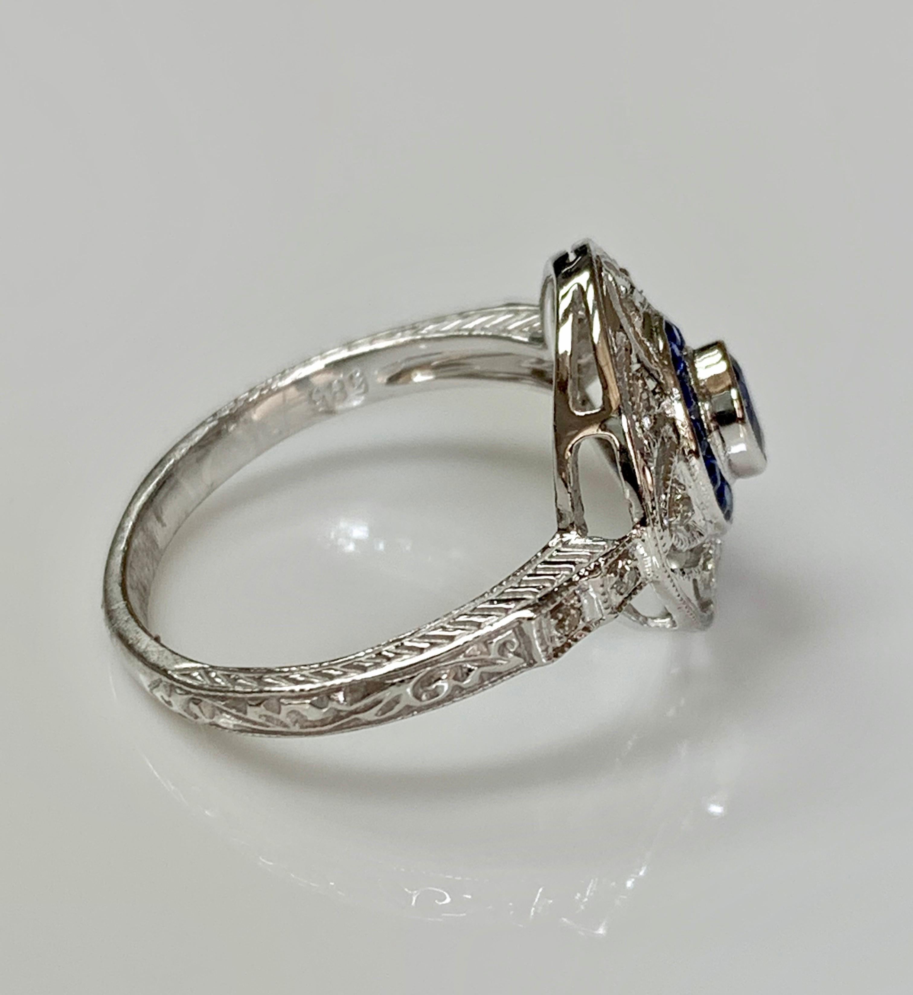 Oval Cut Blue Sapphire and Diamond Ring in 14 Karat White Gold
