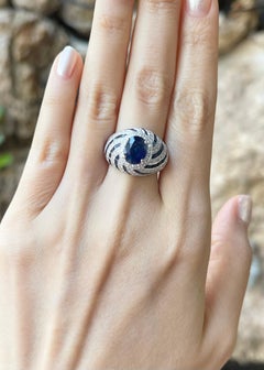 Blue Sapphire and Diamond Ring set in 18K White Gold Settings