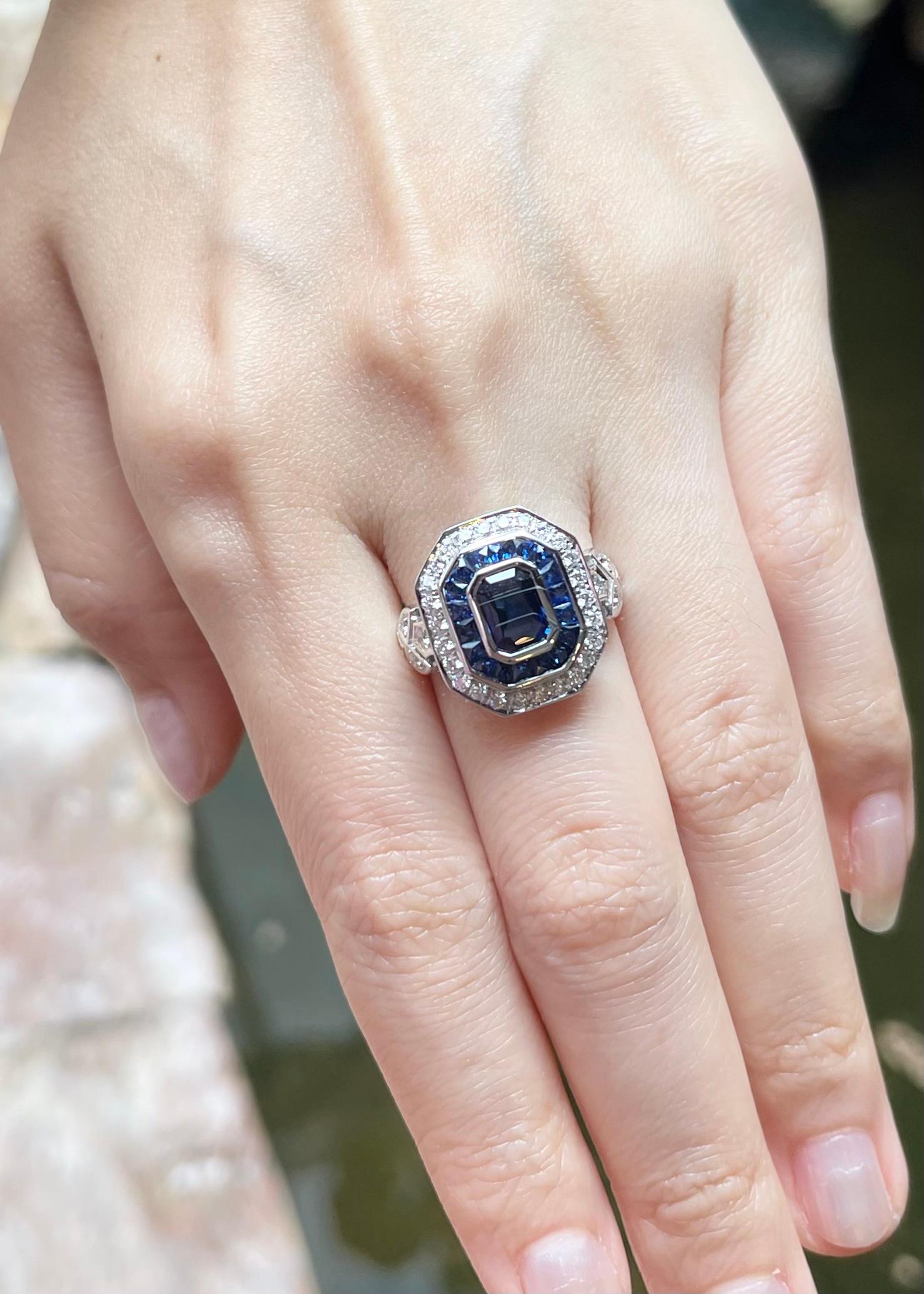 Emerald Cut Blue Sapphire and Diamond Ring set in 18K White Gold Settings For Sale