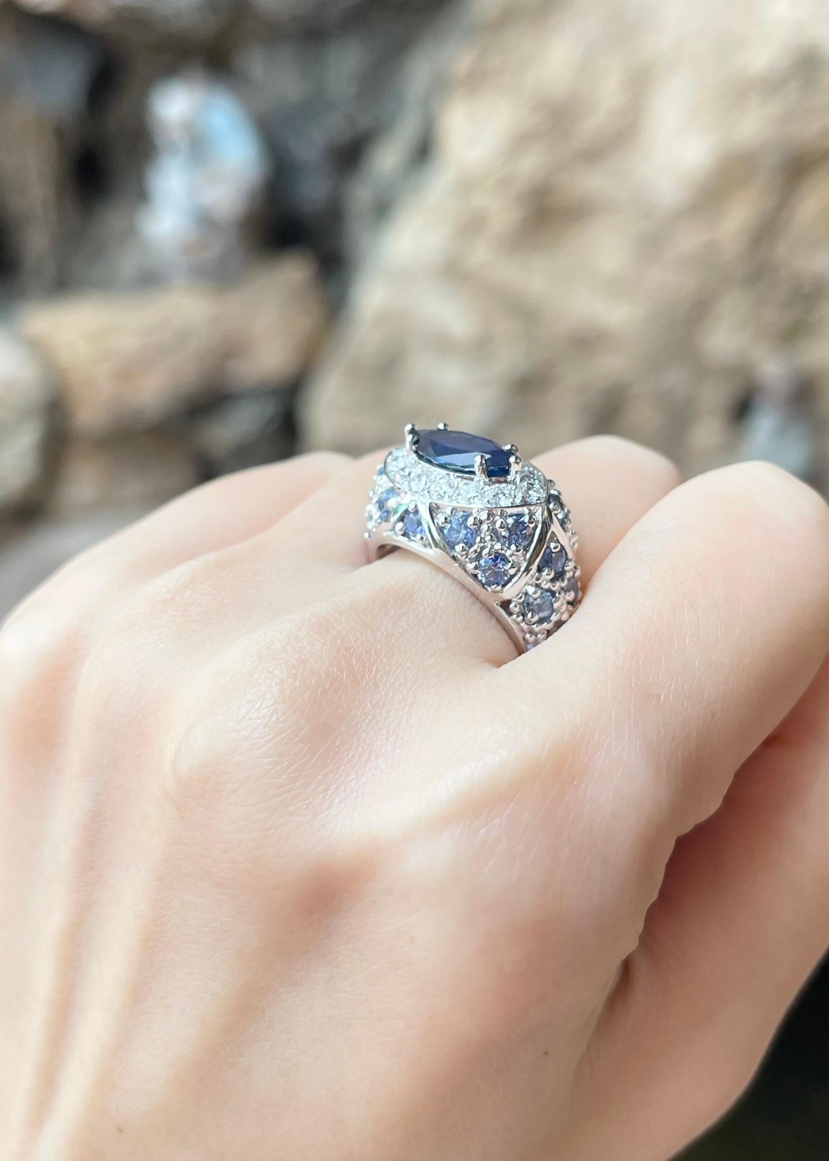 Women's Blue Sapphire and Diamond Ring set in 18K White Gold Settings For Sale